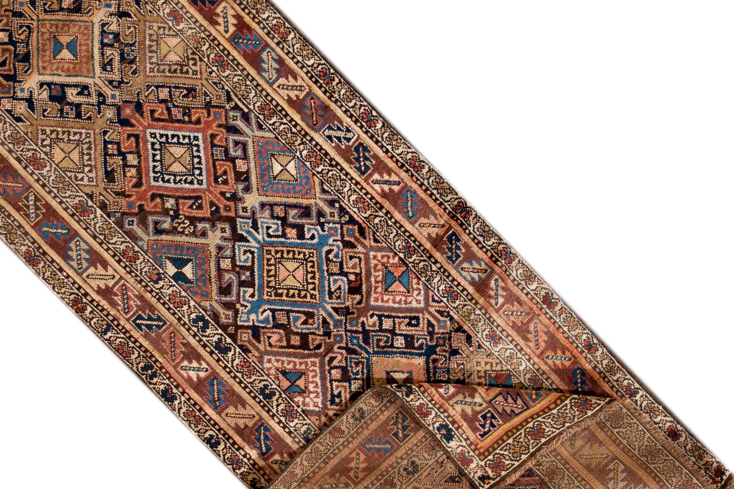 A 20th century antique Persian Kourd rug with a medallion motif. This piece has fine details, great colors, and a beautiful design. It would be the perfect addition to your home. This rug measures 2'11