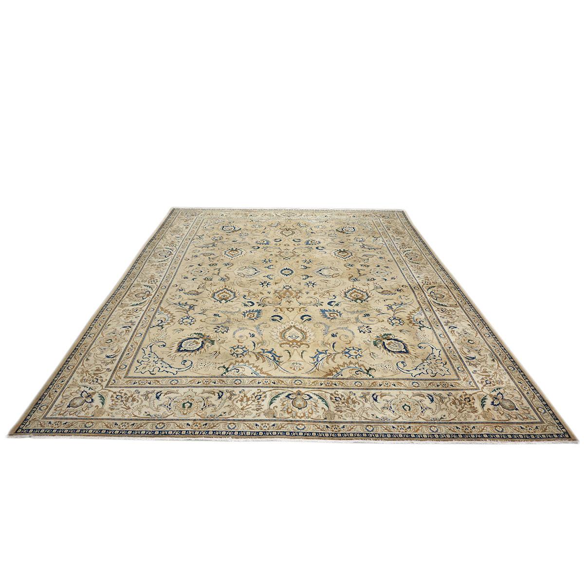 Ashly Fine Rugs presents a wonderful Antique Persian Tabriz from the 1920s. Tabriz is a northern city in modern-day Iran and has forever been famous for the fineness of its handmade rugs. This piece has a tan background with the design, border, and