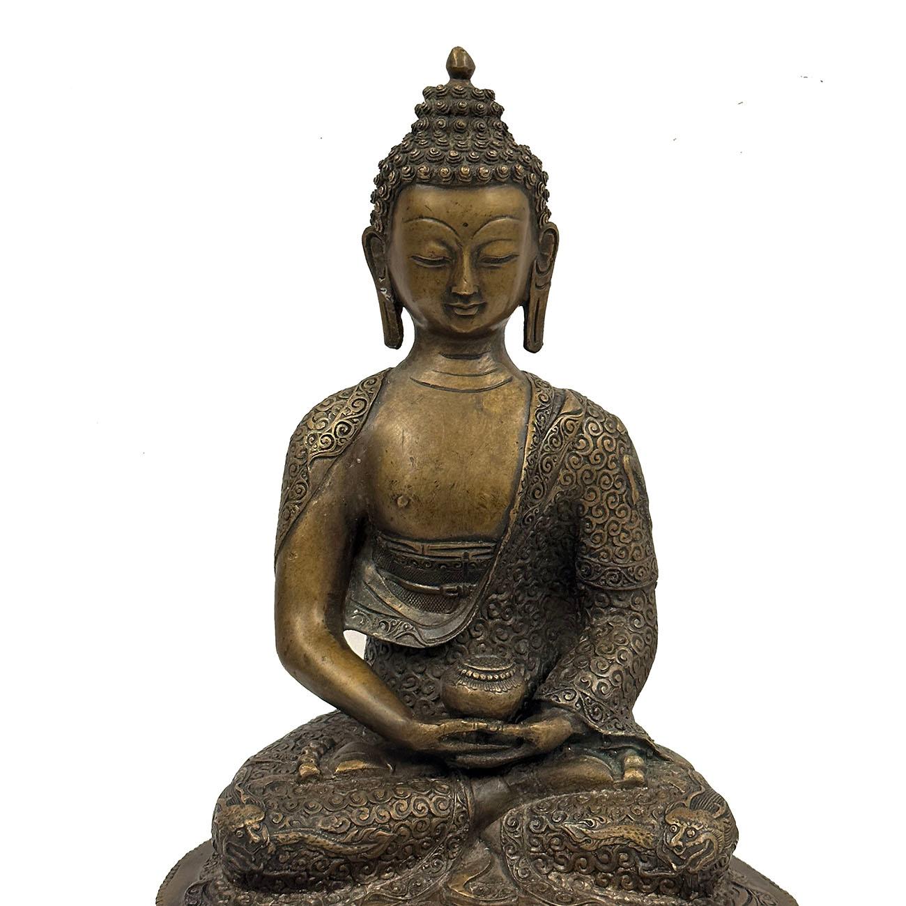 This magnificent Tibetan Antique Bronze Buddha Statuary was hand crafted from Tibetan Bronze with intricated carving works all over the Buddha. It shows the Buddha seated on a double layers lotus seat with very detailed hand carving works on it. You