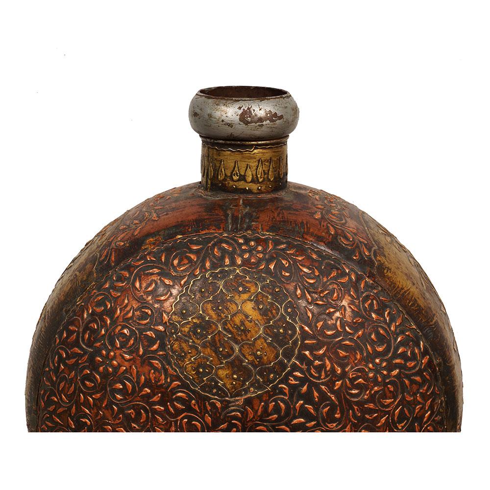 This is handcrafted Tibetan container made from Tibetan copper and tin. It has hand crafted Tibetan folk art all over the container, very detailed carving works. It was designed for water, liqueur and/or milk, etc. It is very popular in Tibetan folk