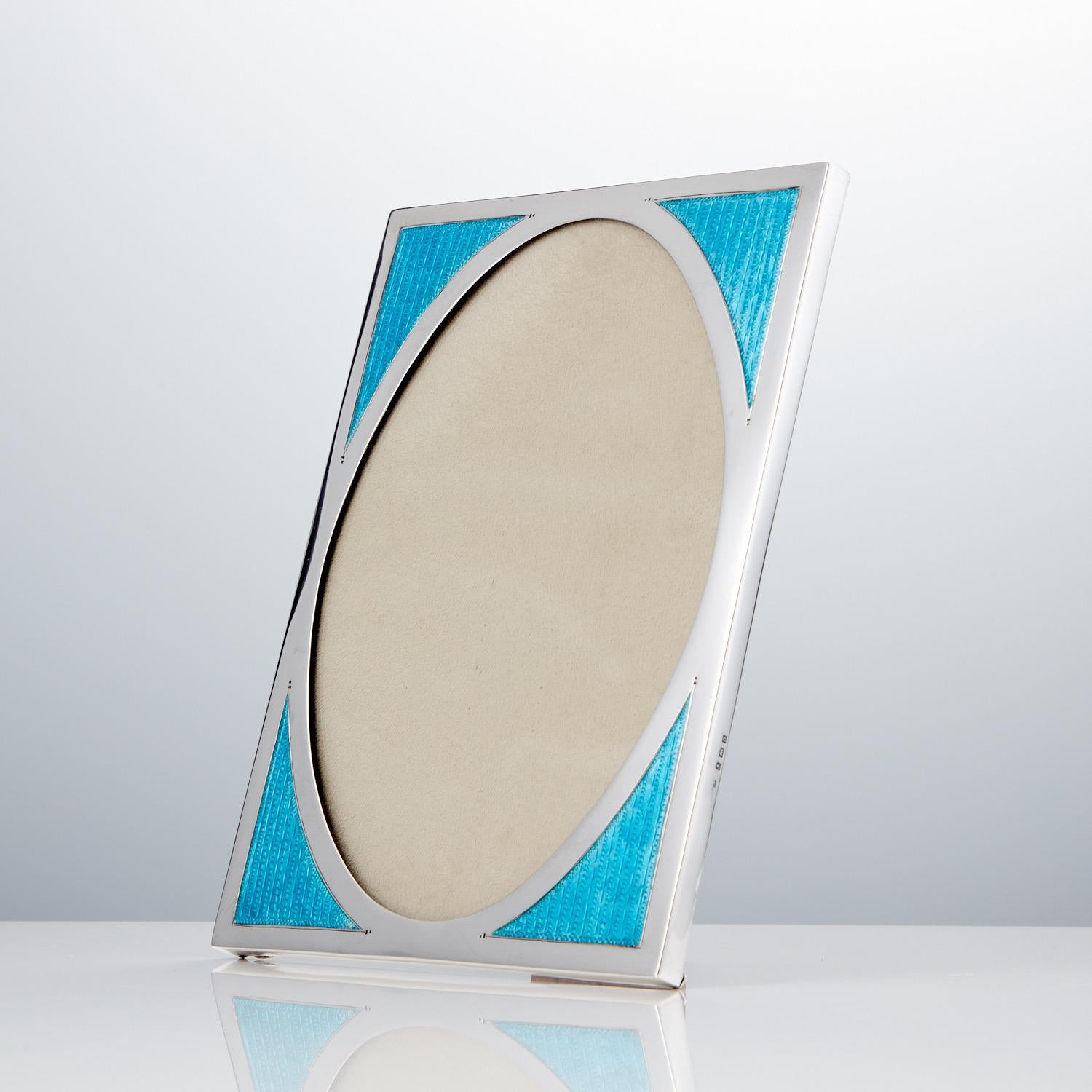 This stunning vibrant aqua marine Art Deco photo frame retains its translucent color. This piece is in excellent condition, the hall marks are in good condition, however the makers mark appears slightly vague points it to be by William Taylor.
The
