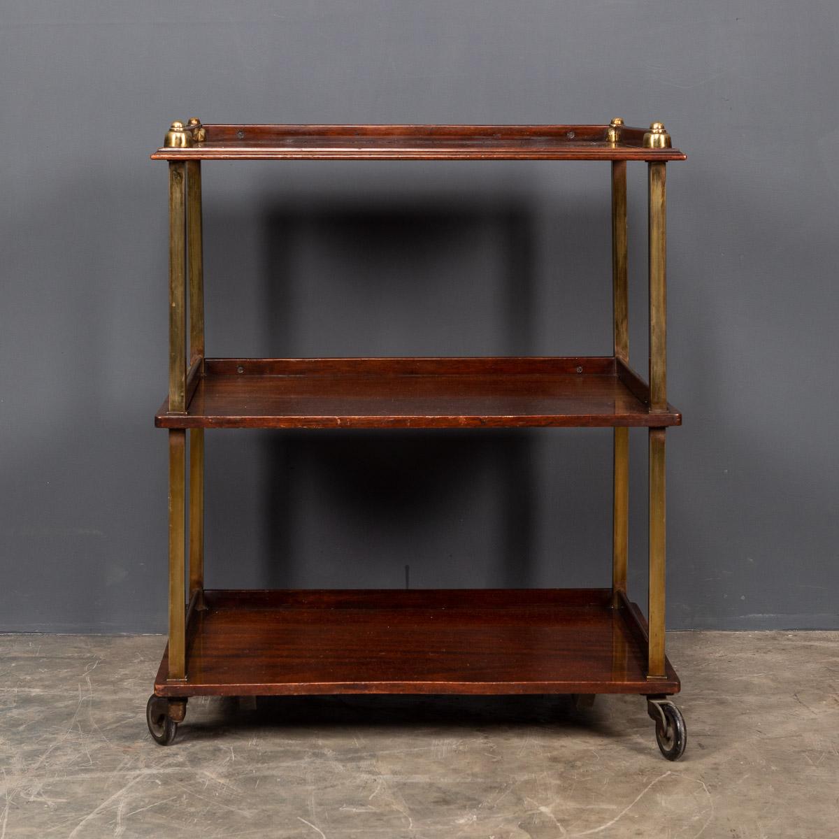 Stylish early-20th century Art Deco three-tier brass and mahogany drinks trolley. A must have for any sophisticated cocktail party.

Condition

In good condition - some wear consistent with age.

Size

Height: 76cm
Width: 63cm
Depth: 42cm.