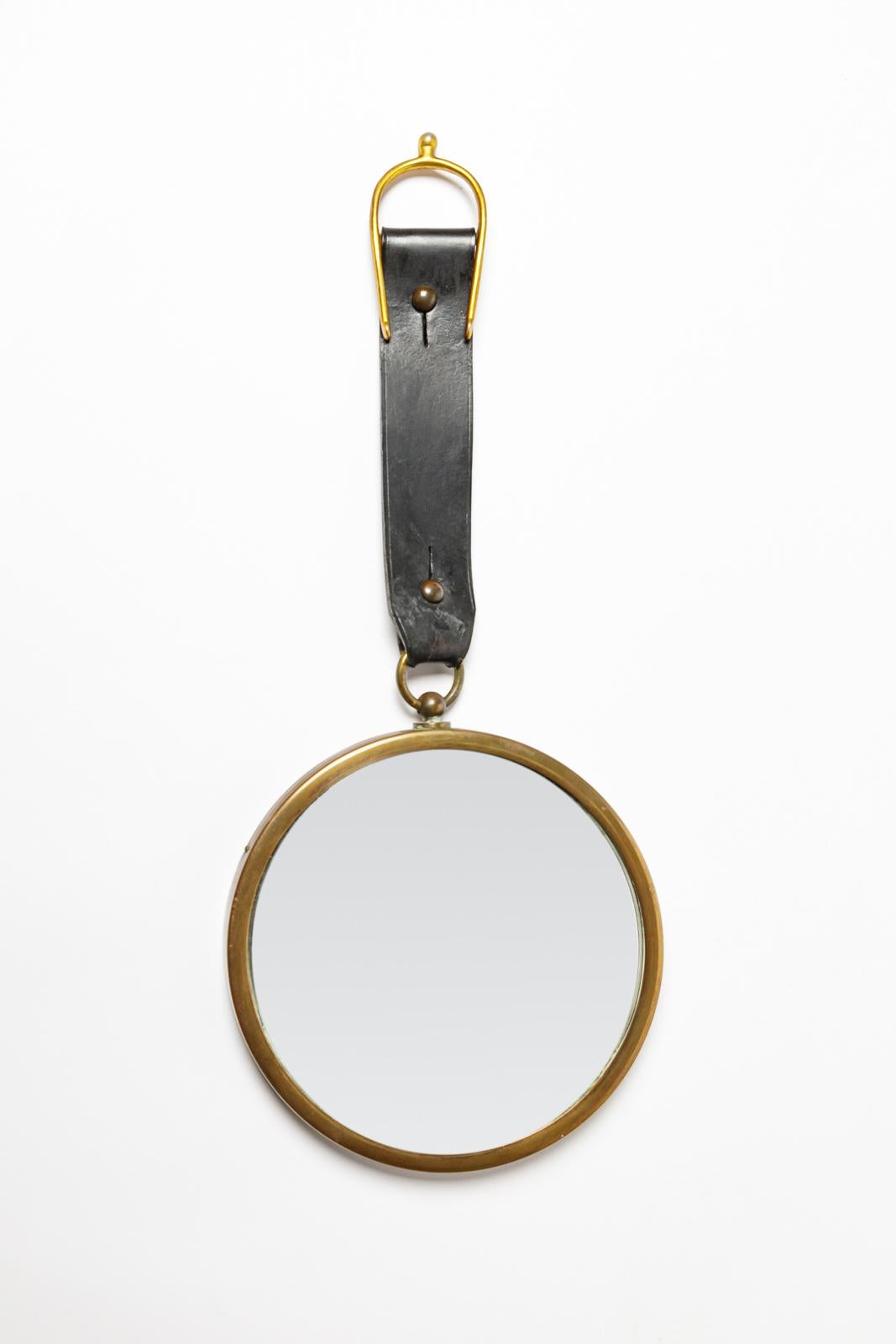 20th Century 20th century art deco design leather and curved wall mirror att. Jacques Adnet For Sale