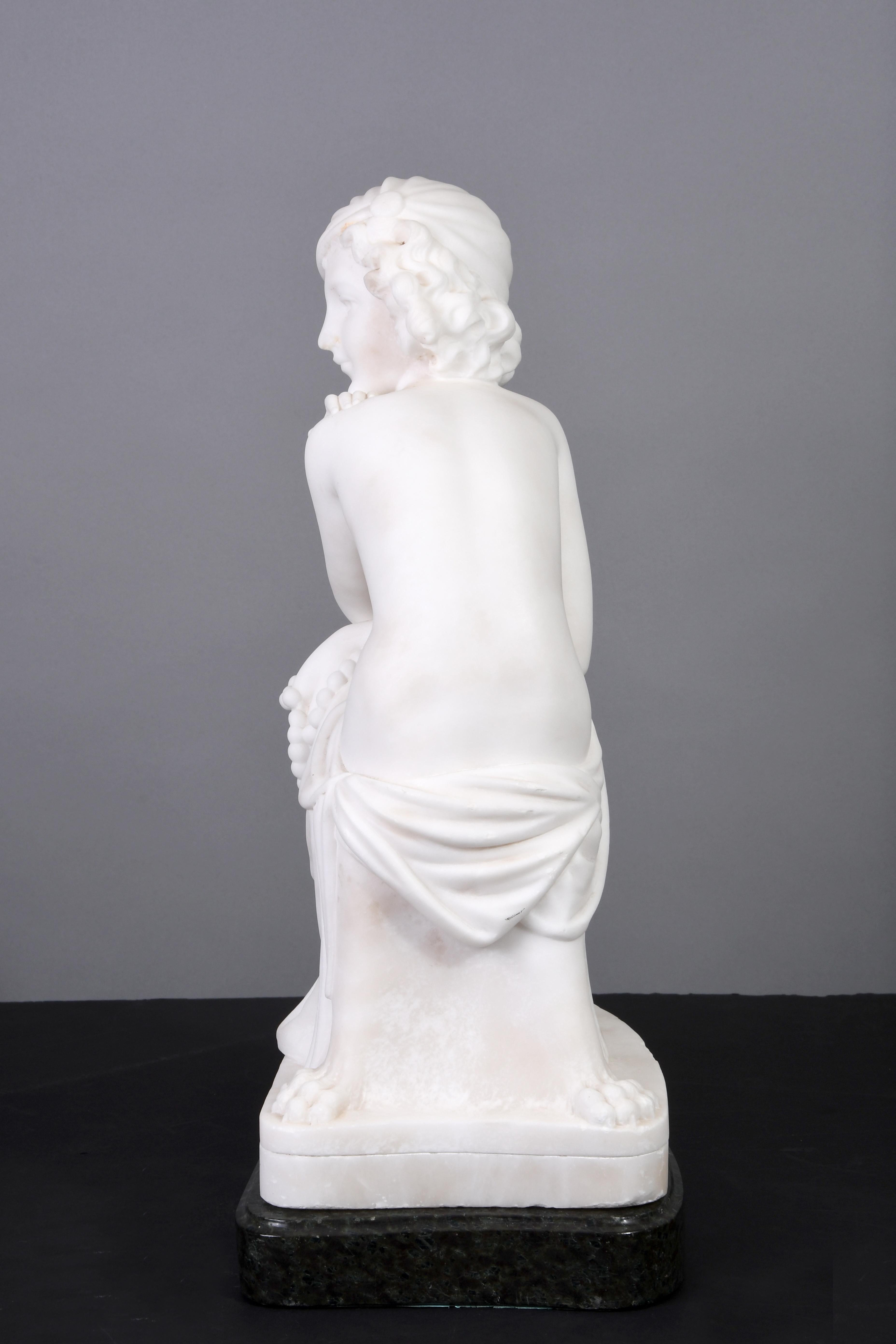 An Art Deco figure of a young girl semi nude in the upper torso carved in white alabaster. She is seated on an Empire chair as an innocent thinker pose holding a pearl necklace in her hand. The sculptor pay attention to specific details regarding