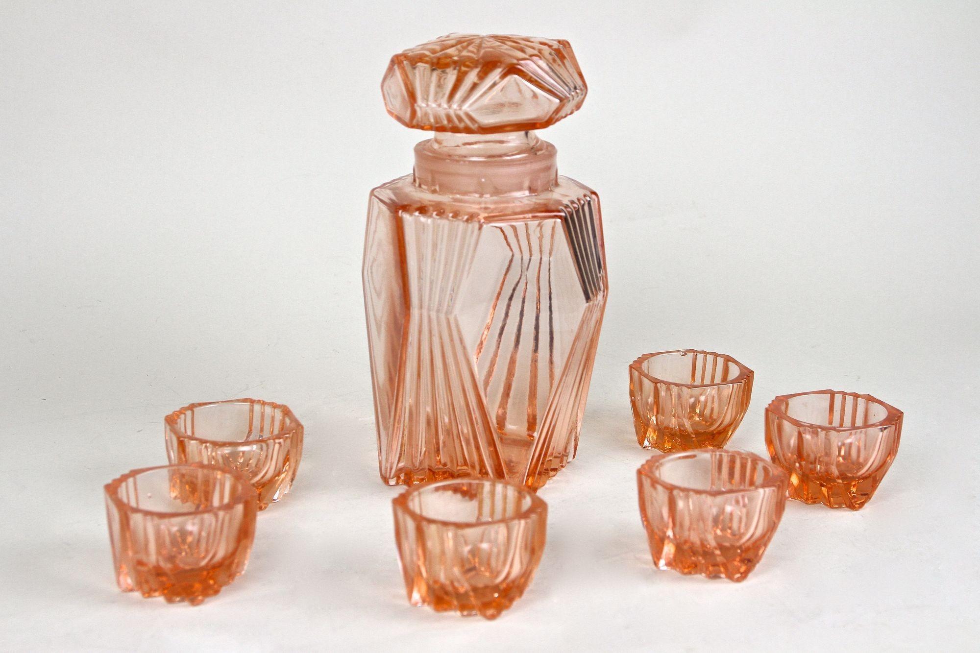 Austrian 20th Century Art Deco Glass Decanter Set Of Seven, Coral Colored, AT ca. 1920 For Sale