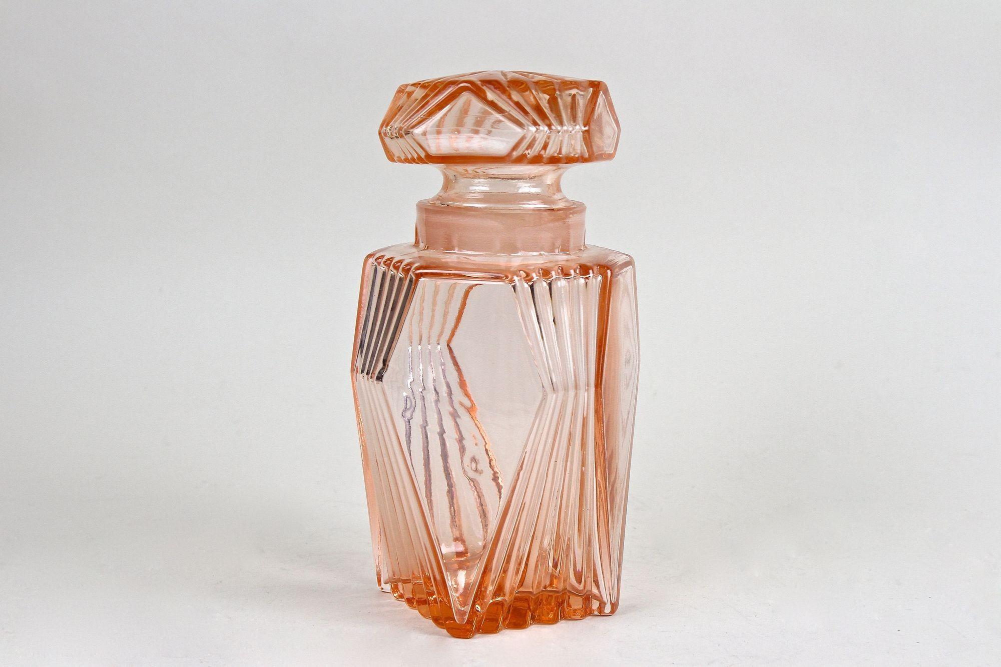Hand-Crafted 20th Century Art Deco Glass Decanter Set Of Seven, Coral Colored, AT ca. 1920 For Sale