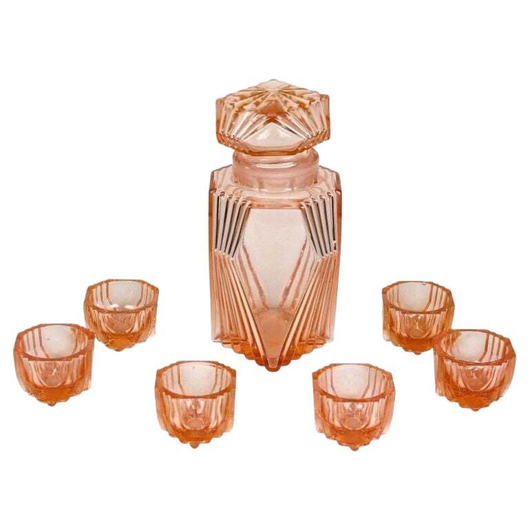20th Century Art Deco Glass Decanter Set Of Seven, Coral Colored, AT ca. 1920 For Sale