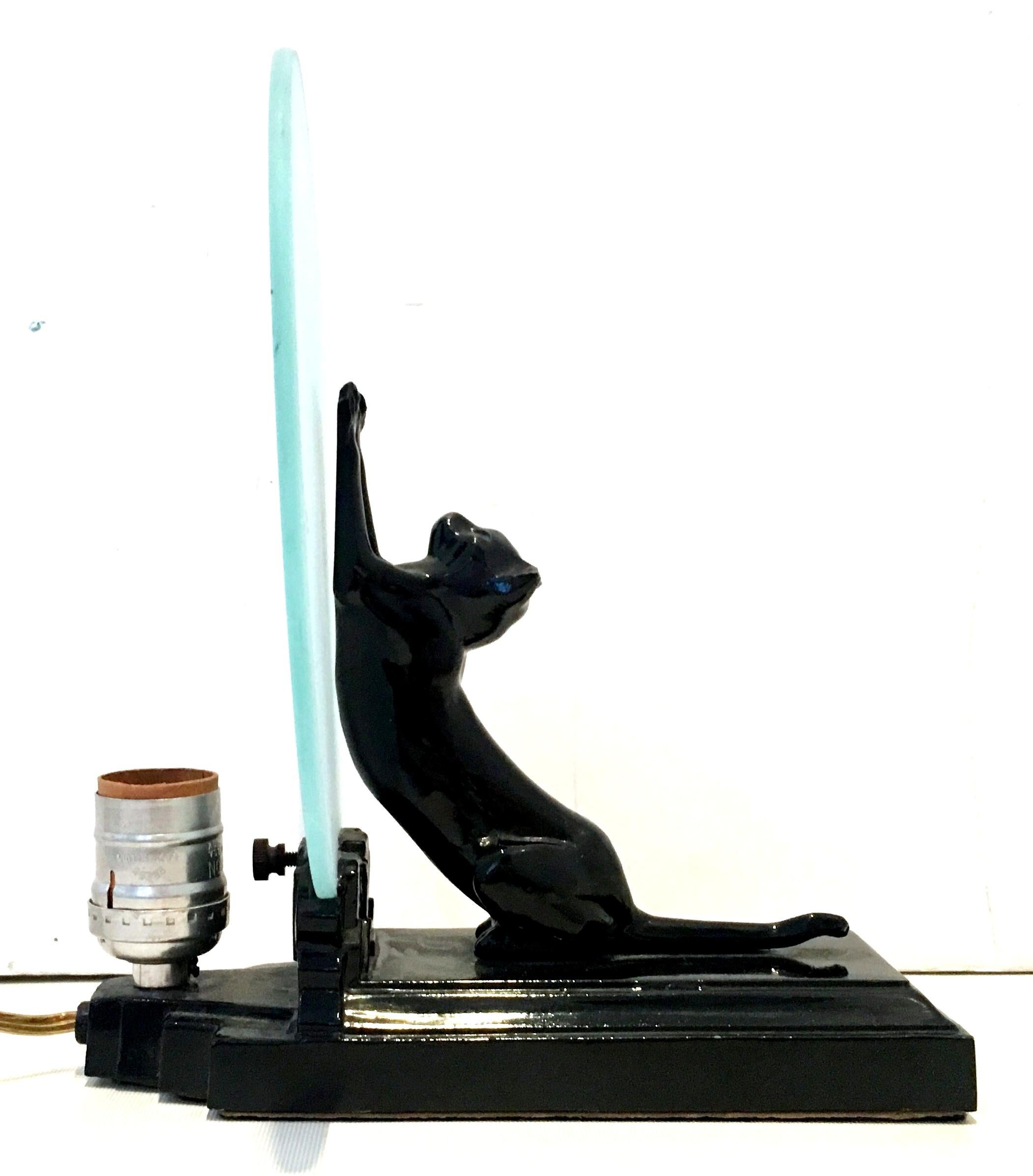 20th Century Art Deco style figural table lamp by Sarsaparilla's. The lamp is comprised of a jet black cast metal base with a figural sculptural cat/panther of approximately 7