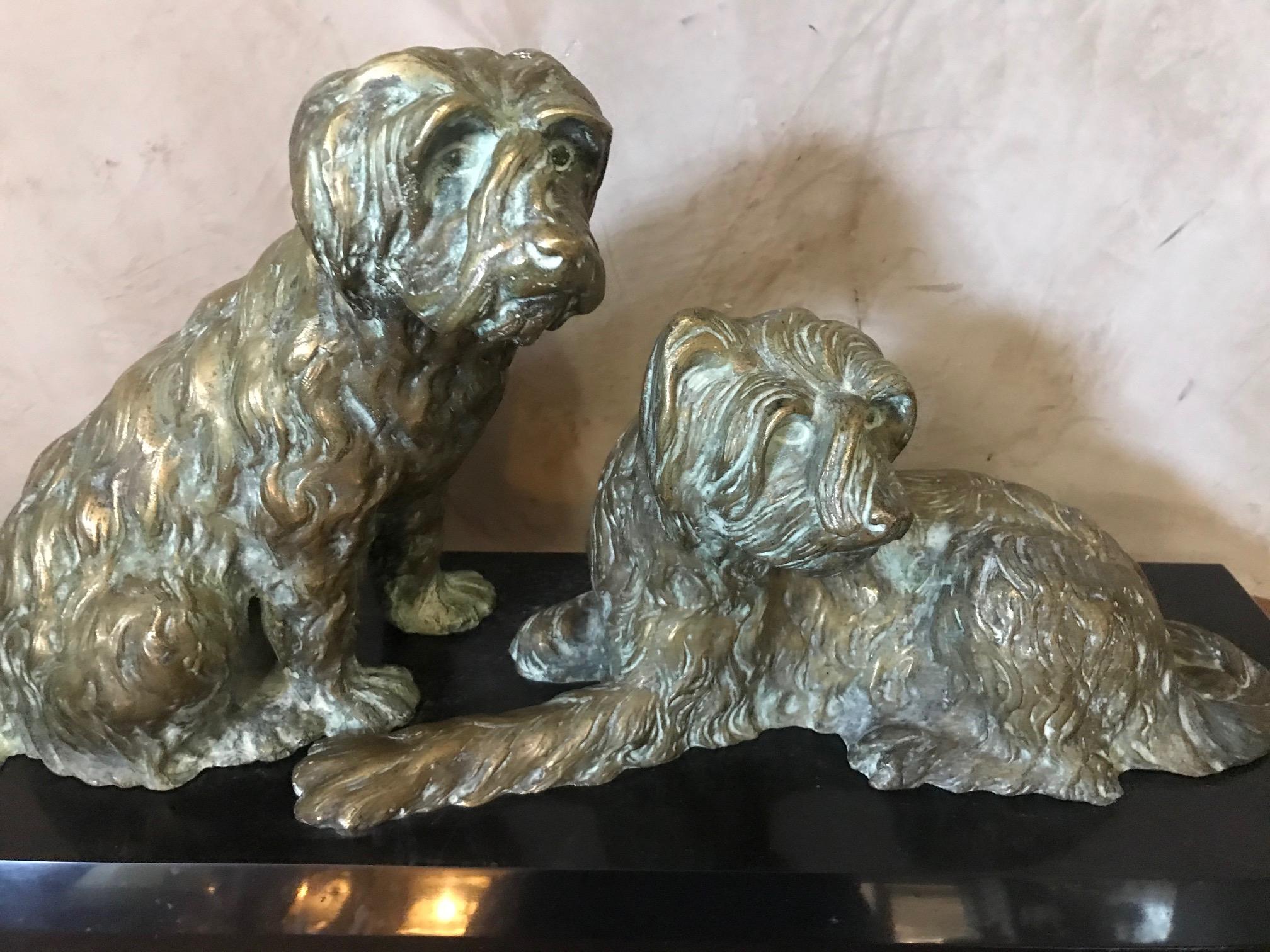 Exceptional 20th century marble and bronze Georges Lavroff dogs sculpture from the 1930s.
Beautiful bronze representing two dogs. The signature of Georges Lavroff is on the seating dog's tail. Black Marble base.
George Lavroff was born in Siberia