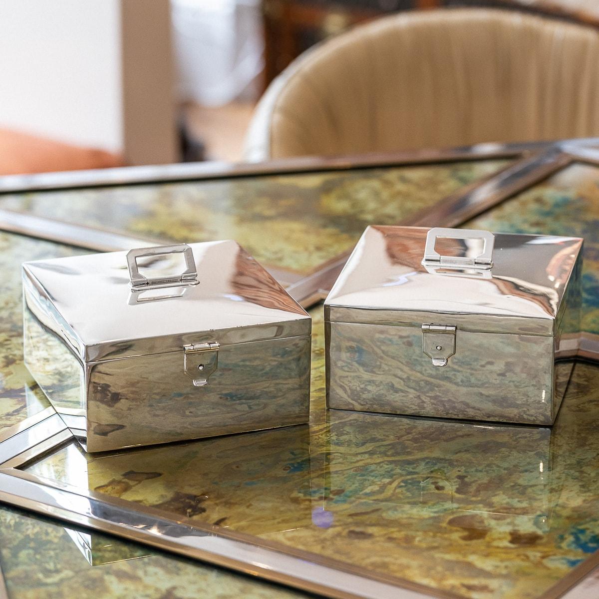 Antique 20th Century British made solid silver pair of portable cigar boxes, made by one of the leading silversmiths of the day, Asprey & Co. The pair of boxes scream Art Deco, elegant and simplistic, very heavy gauge, with clean lines, rectangular