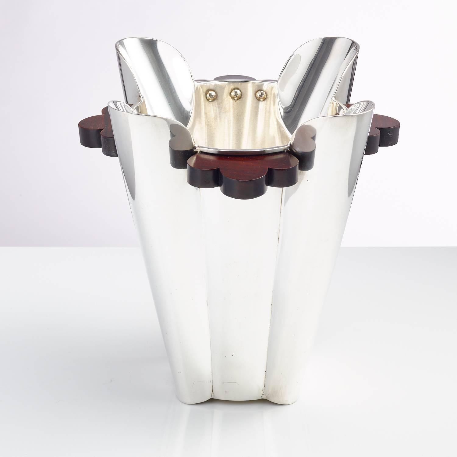 A 20th century Art Deco silver plated champagne cooler or ice bucket with Macassar hardwood handles Italian, circa 1930
The robust heavy body has great form and is enhanced by the heavy duty rivets on the interior inner rim, this piece has also been