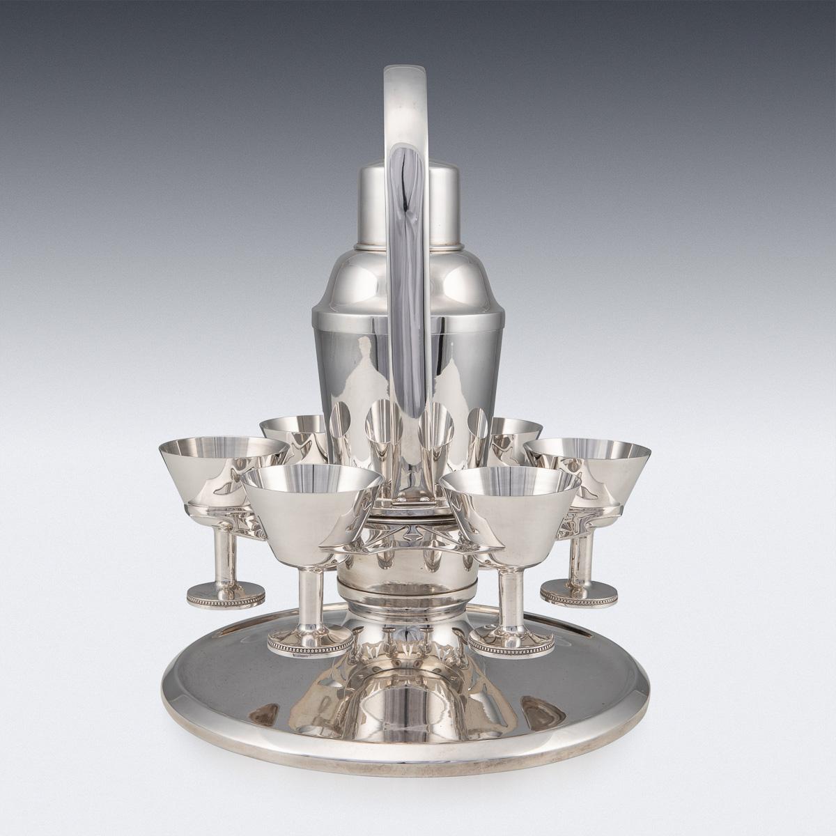 Superb 20th century Swedish silver plated cocktail shaker with six glasses on a stand with silver gilt interior. This cocktail shaker is in fabulous condition and is a must for any collector or just as a stand alone item, as useful today as it was