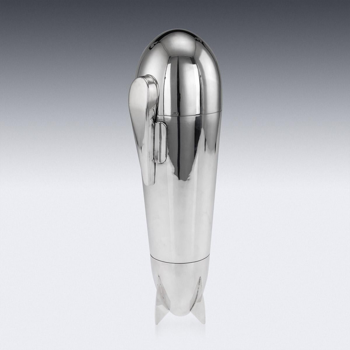 Antique 20th century Art Deco silver plated ‘Zeppelin’ shaped cocktail shaker, of large proportions, the body acting as a shaker, with a slide detachable undercarriage enclosing four spoons, the gilt interior enclosing a detachable strainer, four
