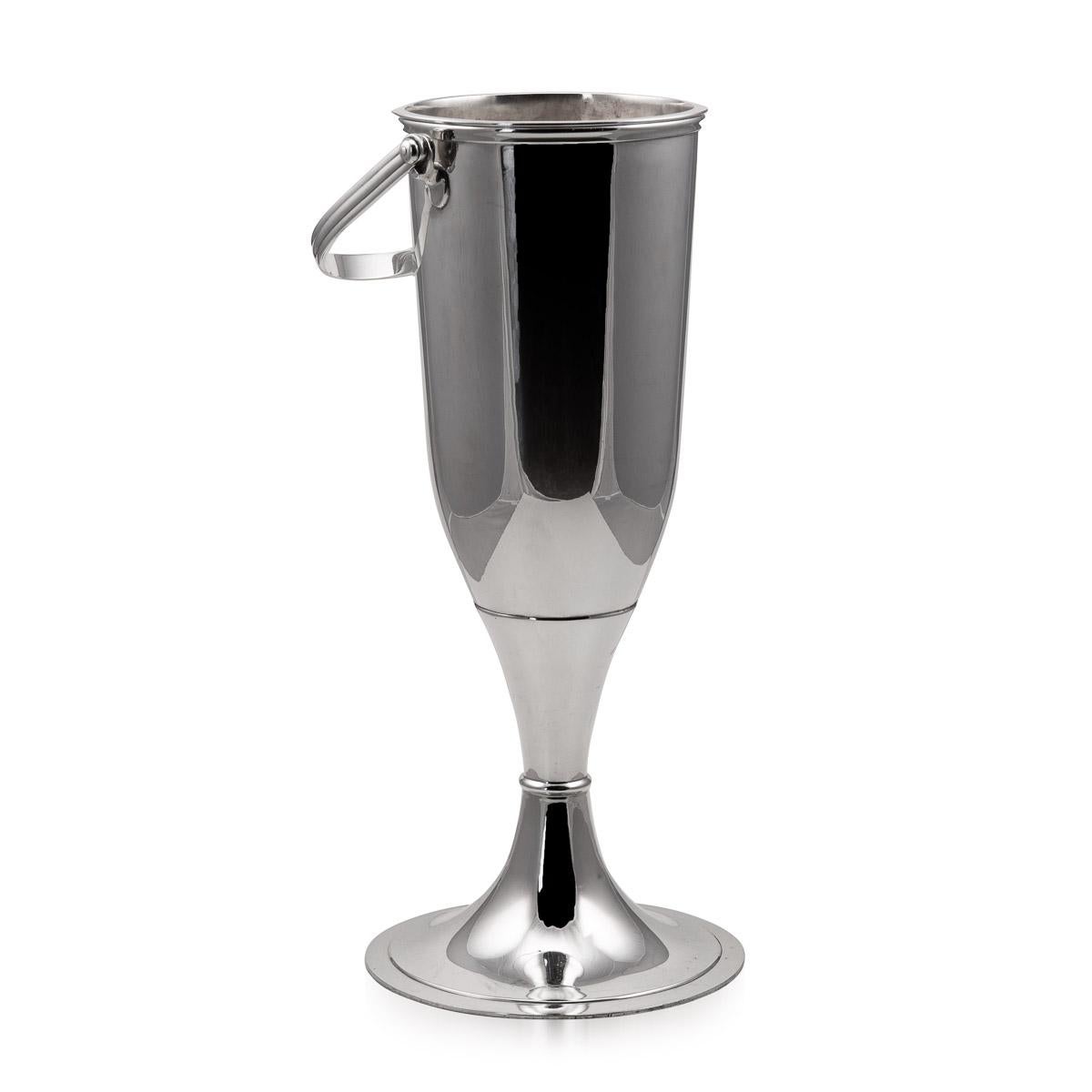 20th Century Art Deco silver plated wine cooler and stand. This set is as relevant today as it was then, it makes a fantastic statement piece and wonderful as part of a collection of barware in the modern home.

Conditions
In Great Condition - No