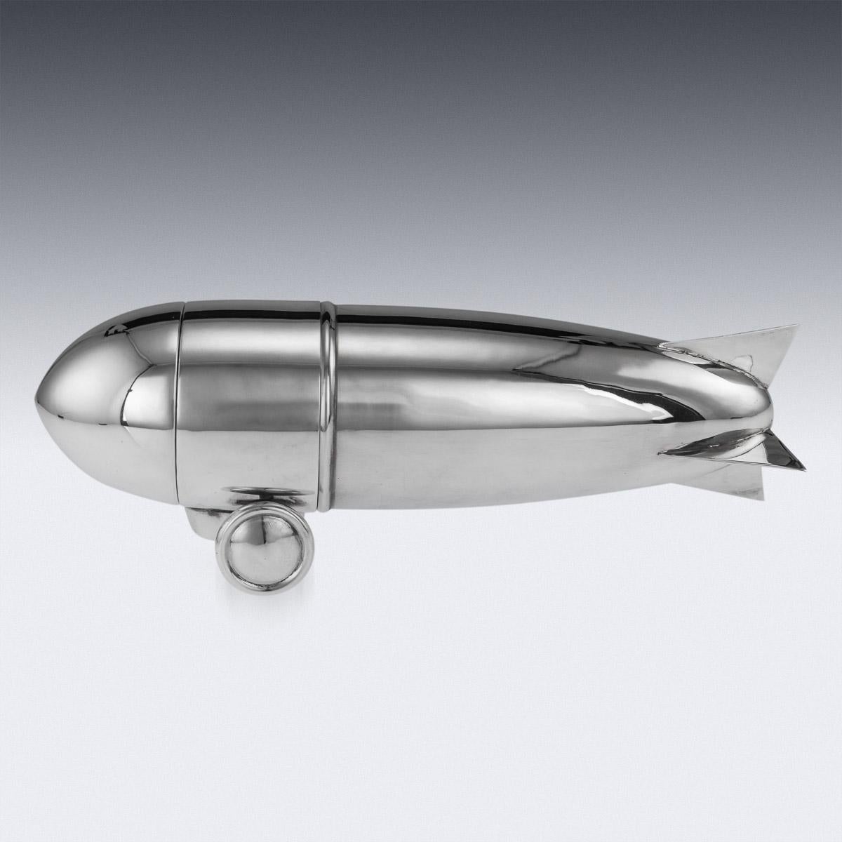 Superb 20th Century Art Deco style silver plated ‘Zeppelin’ shaped cocktail shaker, of large proportions, the body acting as a shaker, with a detachable strainer.

This cocktail shaker is in fabulous condition and is a must for any collector or just