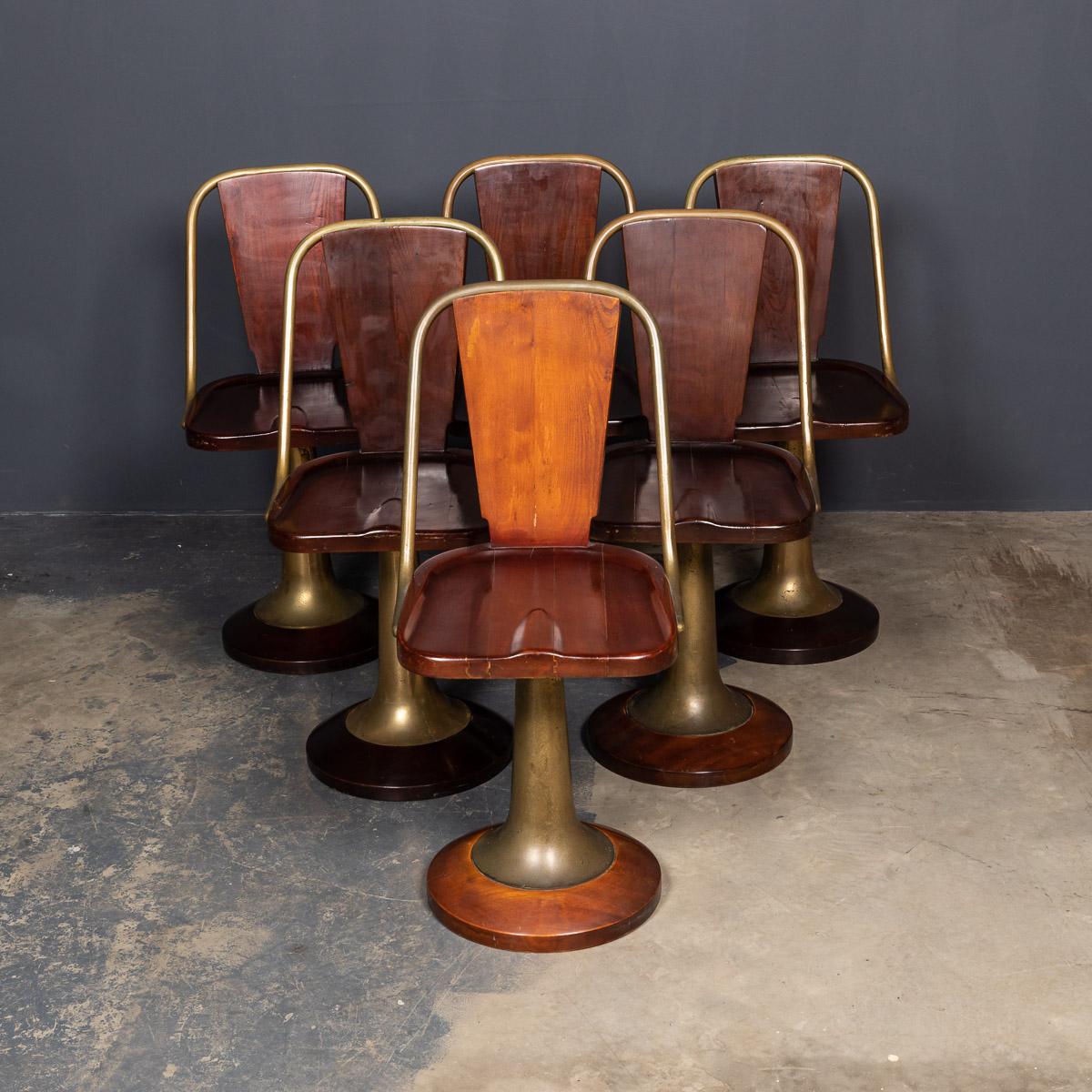 Antique early-20th century Art Deco set of six solid mahogany & turned brass swivel chairs were salvaged from the famous Giuseppe Verdi passenger steamer ship. Each beautifully styled seat stands on a weighted pedestal foot made in brass. Embedded