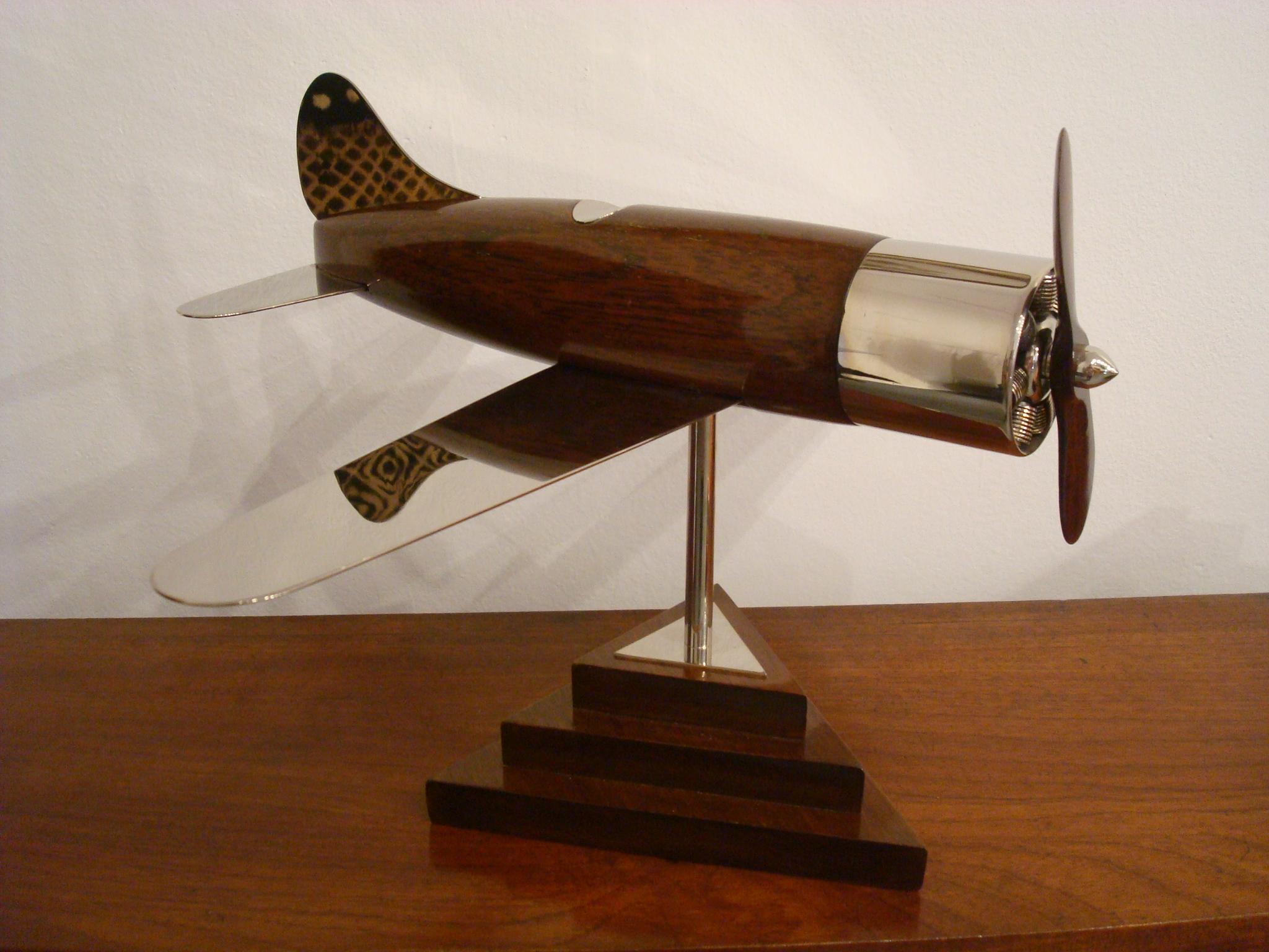 Very nice large 20th century, Art Deco streamline airplane wooden desk model sculpture. Perfect for any aviation fan. Made of wooden and silvered brass. Professional restoration has been made. Excellent conditions. Fantastic details in the engine.