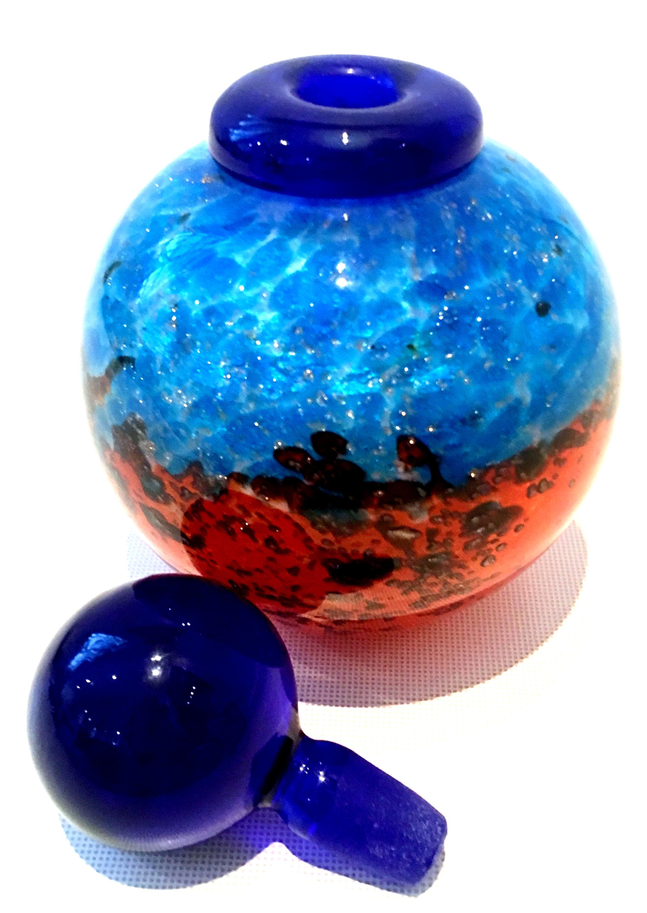 20th century artist signed art glass & 22-karat gold fleck perfume decanter with stopper. This fine handcrafted, one of a kind blown art glass perfume decanter features, a bulbous shape, vivid orange and shades of blue with 22-karat gold fleck