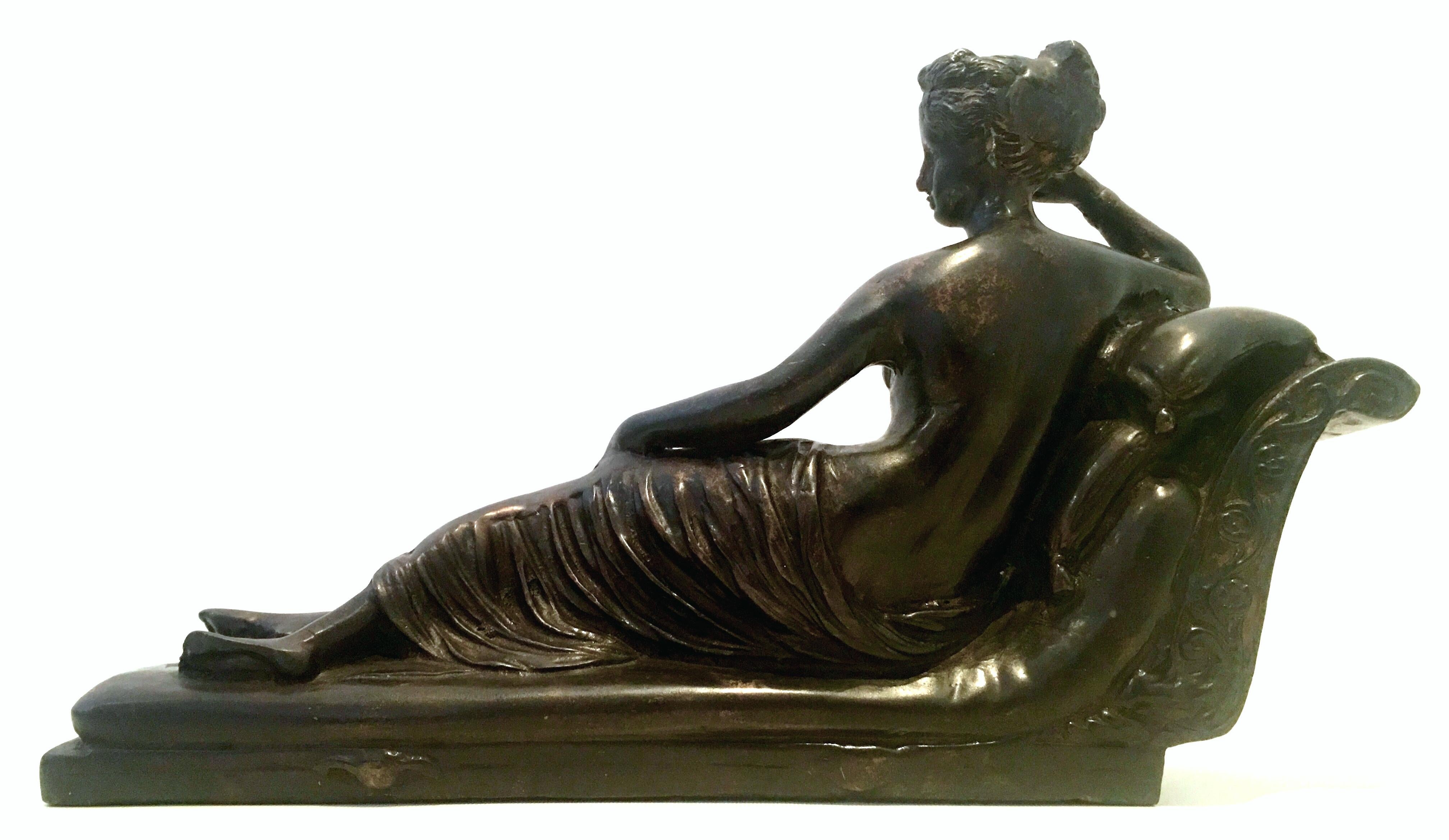 Mid-20th century Art Nouveau large scale cast bronze nude female lounging sculpture. This substantial piece features a nude woman lounging in a chaise. This finely crafted bronze sculpture shows great attention to detail.

  