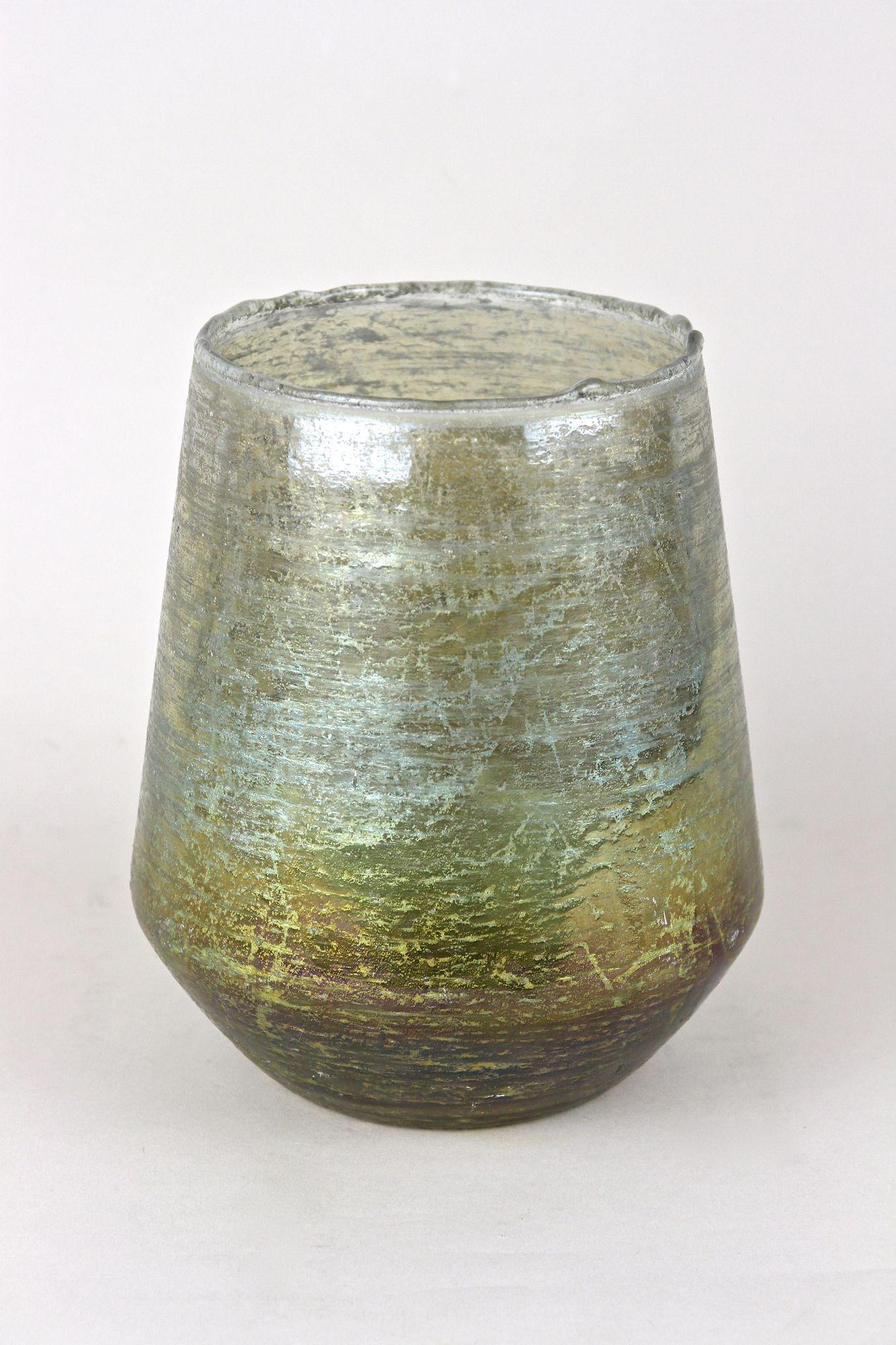 Absolute extraordinary Art Nouveau glass vase out of Bohemia (Czech Republic) from the beginning of the 20th century around 1910. This artfully mouthblown early 20th century masterpiece of bohemian glass art impresses with an unusual rough,