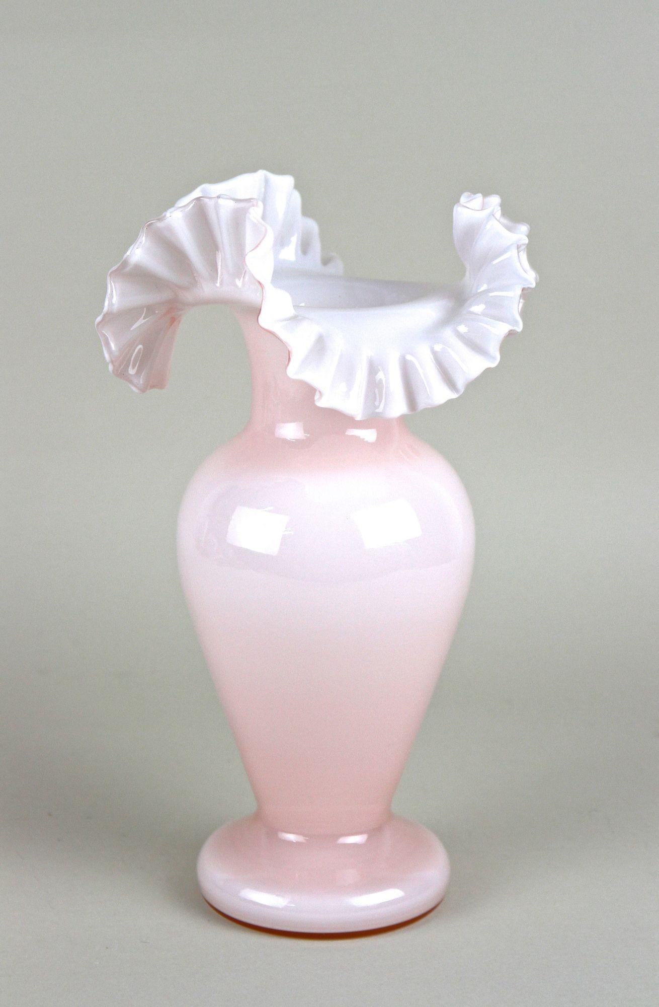 Lovely, early 20th century glass vase with frilly edge coming from the famous Art Nouveau period in Austria around 1900. The mouthblown light pink flashed glass body shows a beautiful bulby design. An absolute highlight on this special Art Nouveau