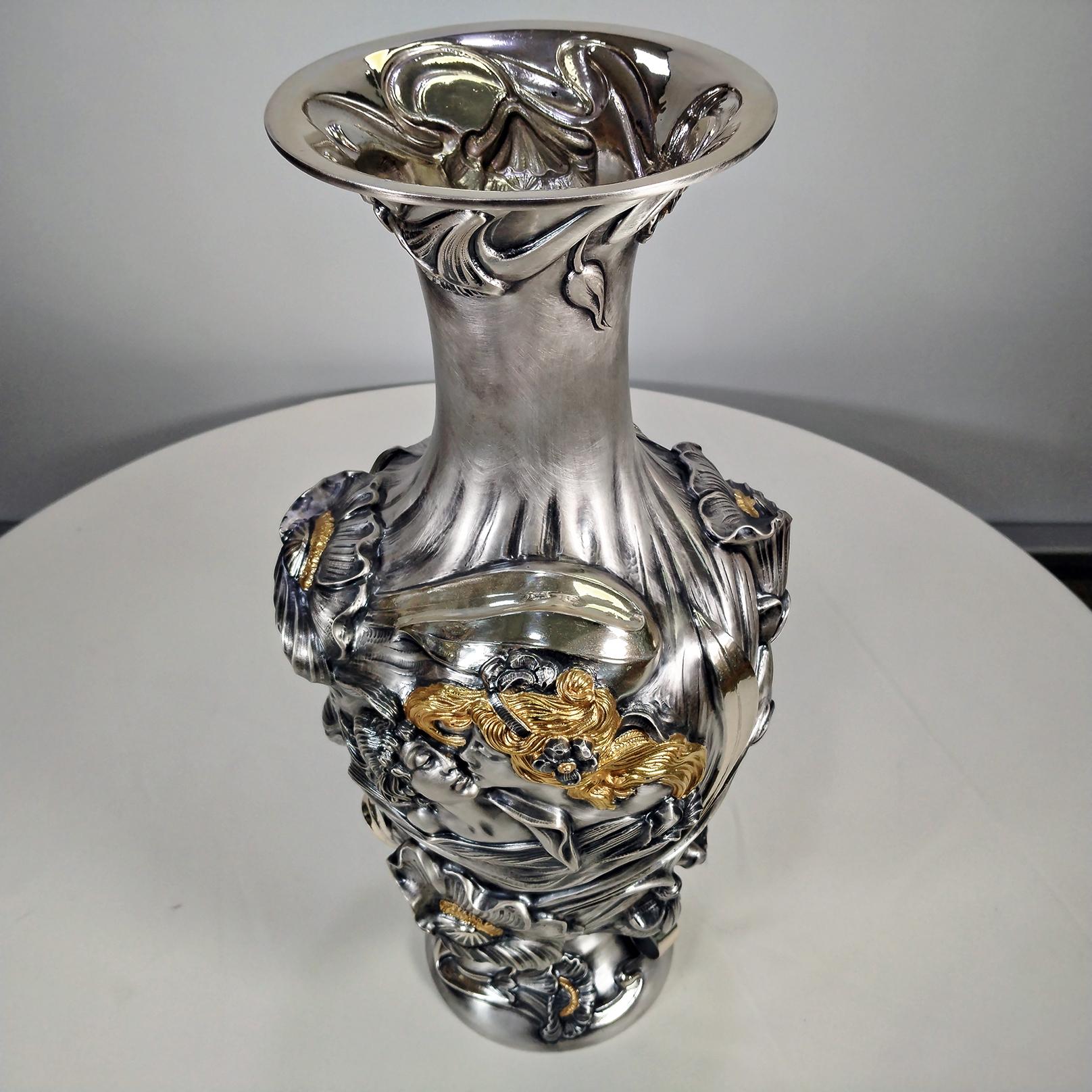 Sterling silver vase in Art Nouveau - Liberty style made entirely by hand.
The preparation of the structure of the vase required several processing times. The vase was made in different parts, base, body, mouth and inserts and subsequently assembled