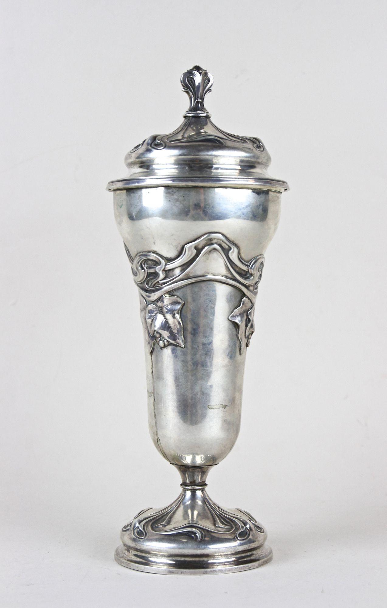 Delightful solid silver amphora vase with lid from the early Art Nouveau period in Austria around 1900. Artfully handcrafted of 402 gramm of fine silver, it shows a very elegant design adorned by lovely embossed, typical floral/ organic Art Nouveau