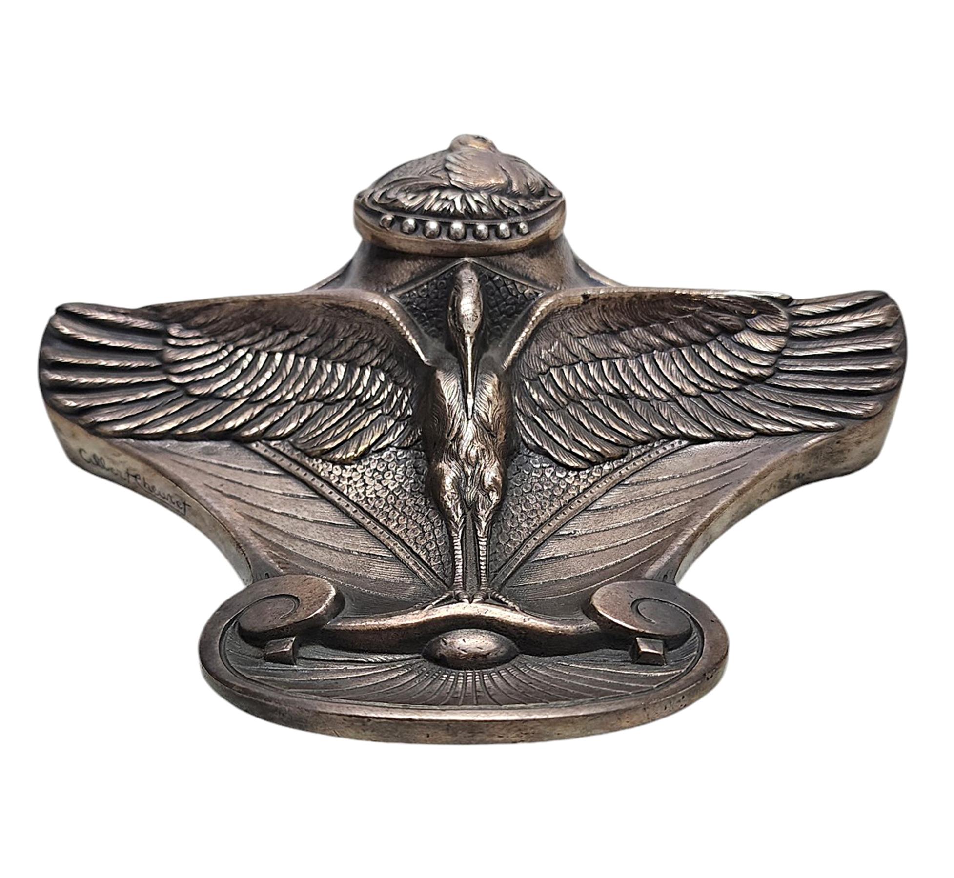 Early 20th century Art Nouveau silvered bronze inkwell of a stork with extended wings by Albert Cheuret, France

By: Albert Cheuret
Material: bronze, copper, metal, silver
Technique: cast, molded, metalwork, silvered, polished
Dimensions: 5 in x 7
