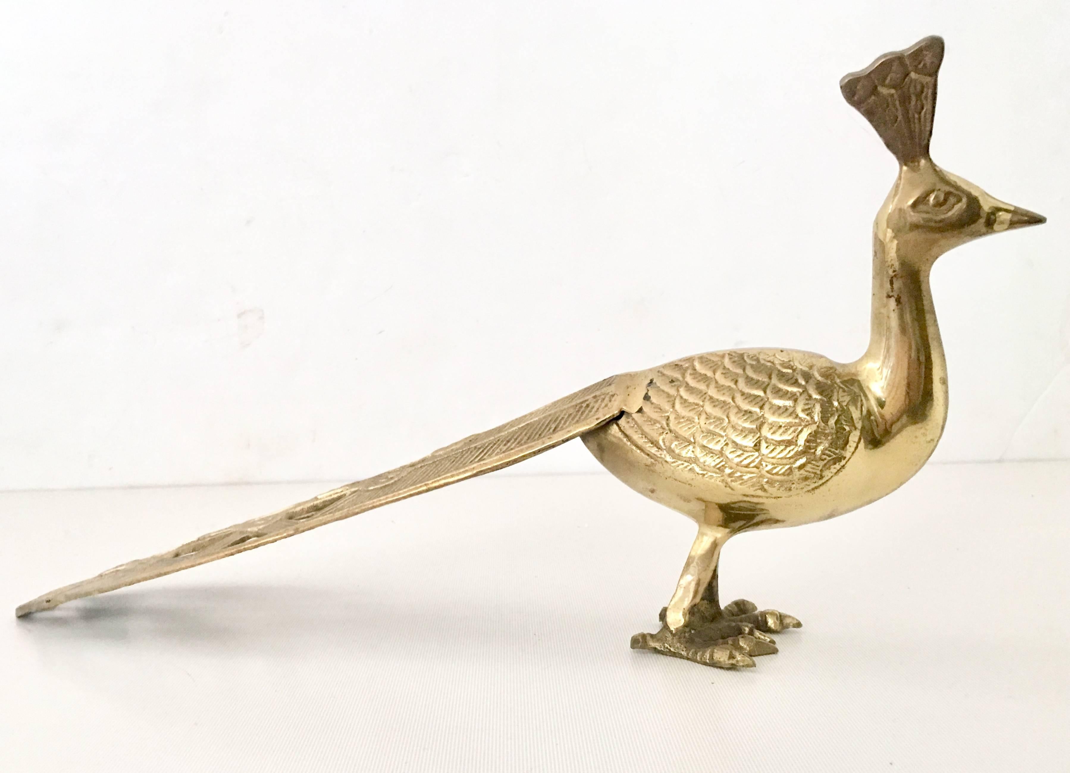 20th Century Art Nouveau style long tail solid brass peacock sculpture.