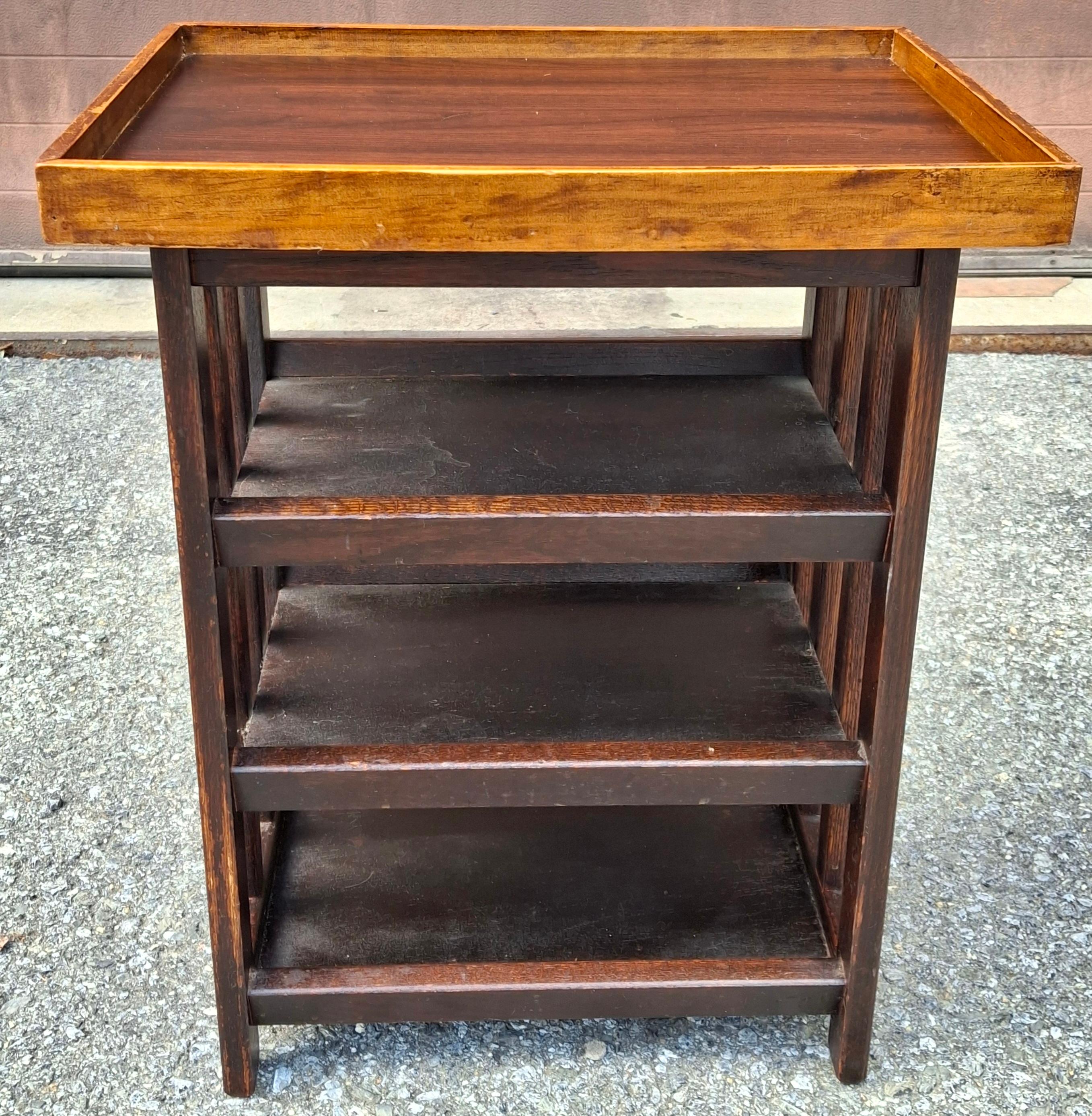 A late 20th Century Arts and Crafts Stained Oak Four Tier Etagere / Side Table
Measures: 20