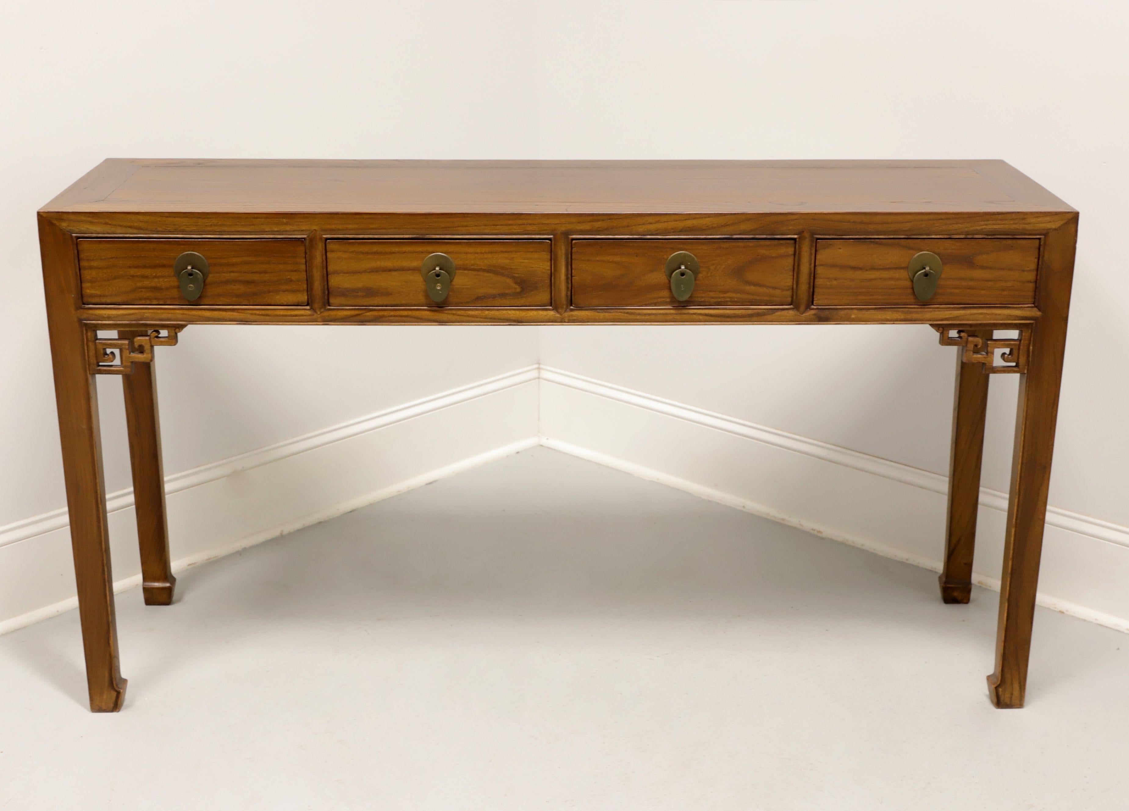 An Asian style console table, unbranded. Chinese elm with banded square edged top, brass hardware, decorative fretwork to corners, square straight legs, and turned inward feet. Features four drawers of dovetail construction. Likely made in the USA,