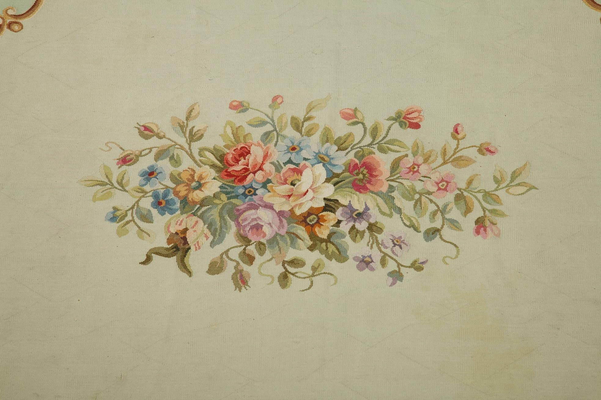 Handwoven rug crafted by Aubusson Manufactory in the 1950s, decorated with polychrome bouquets of flowers, acanthus leaves and foliated scrolls, in 18th century taste. Signed: M. FOUGEROL and AUBUSSON,

circa 1950
Dimensions: W 116.5 in - D