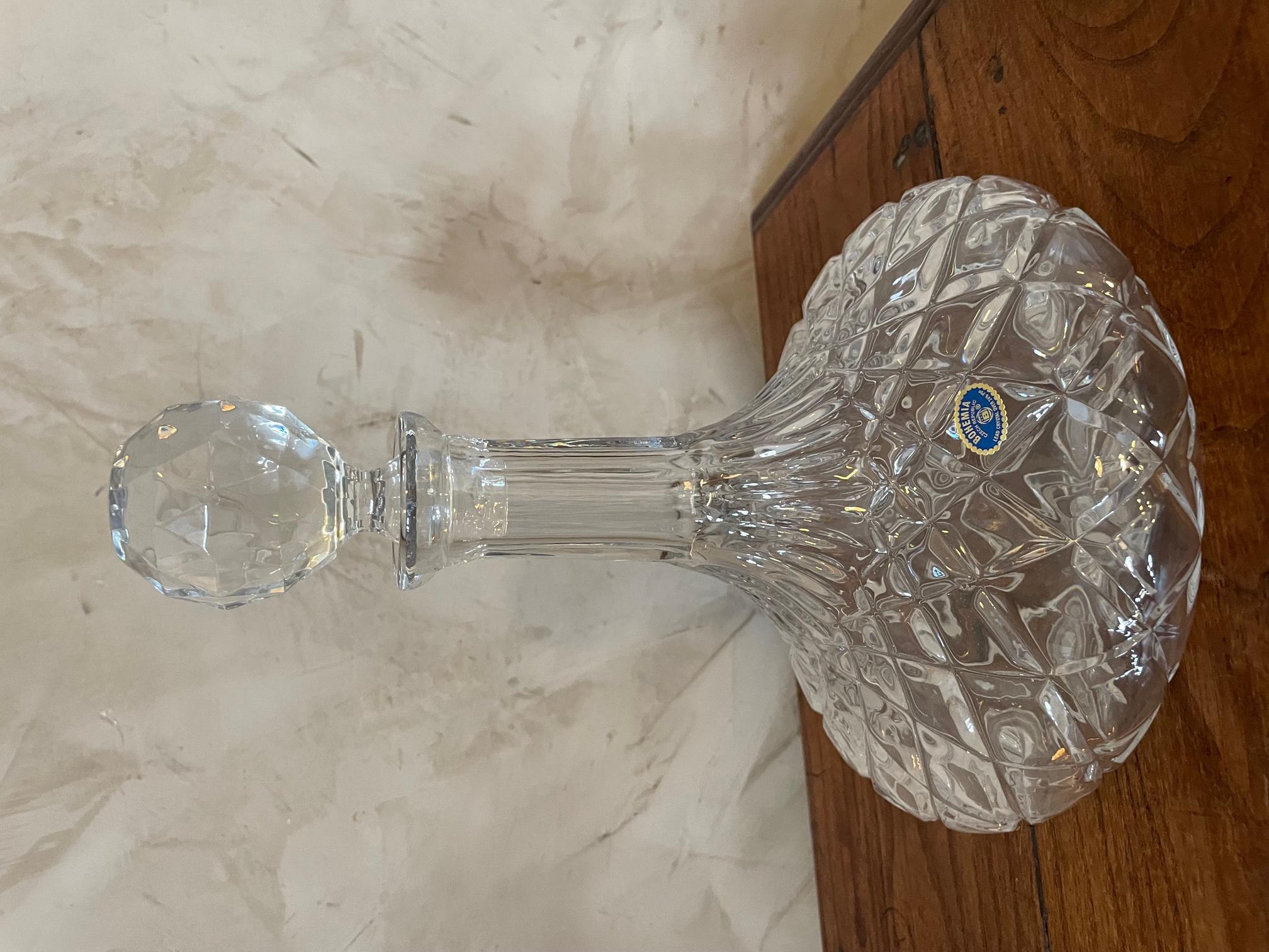 Very beautiful bohemian crystal decanter from the 1950s.
Magnificent quality. Very beautiful details engraved in the crystal.
Stamp of bohemian crystal. Delivered in its original boxe.