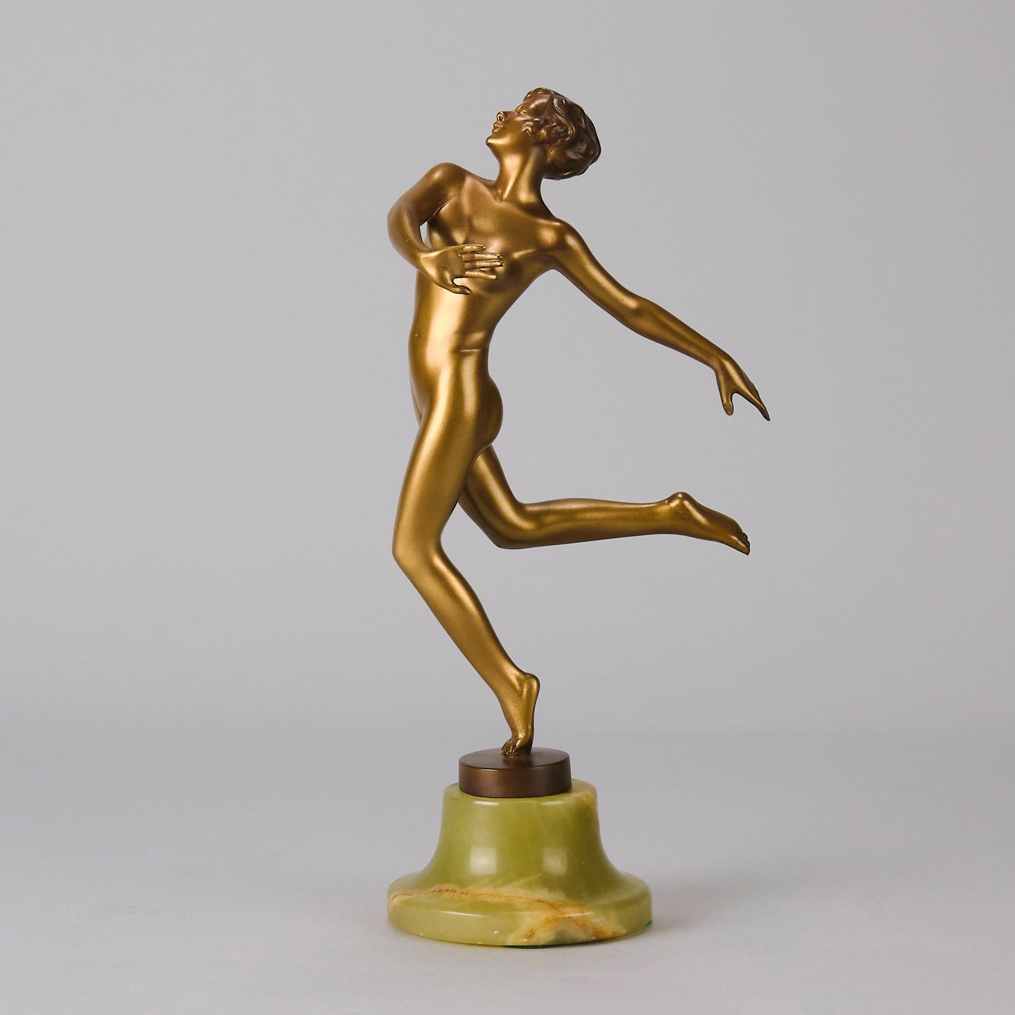 A fabulous early 20th Century Art Deco cold painted bronze figure of a naked dancer in an elegant flowing pose, exhibiting excellent colour and fine hand finished detail, raised on a green onyx base and signed Lorenzl
Additional