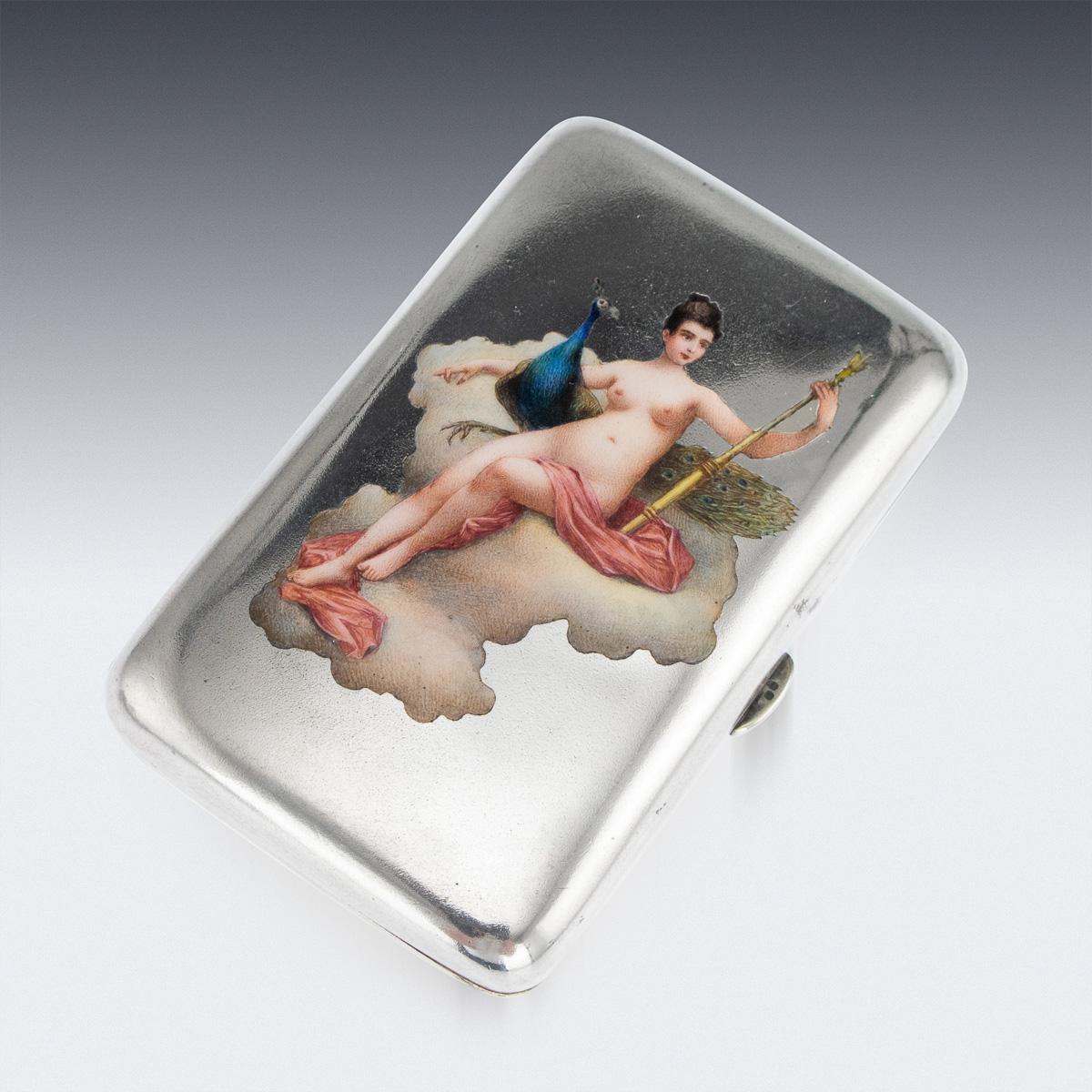 Antique early 20th century Austrian risqué solid silver & enamel cigarette case, of rounded rectangular form, the surface of one side applied with a hand painted, multicolored and shaded enamels depicting Juno with her peacock seated on a cloud, the