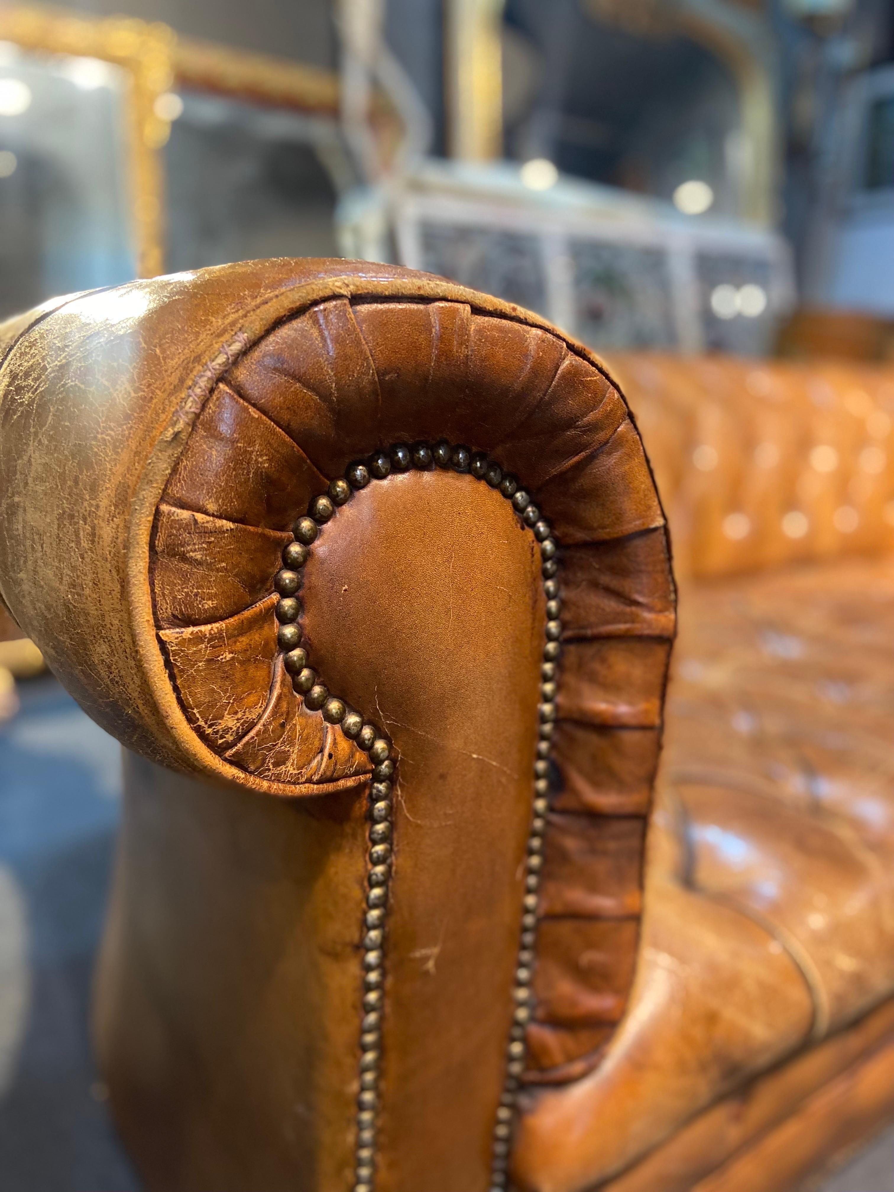 British 20th Century, Authentic Brown Leather Chesterfield on Castors Made in England For Sale
