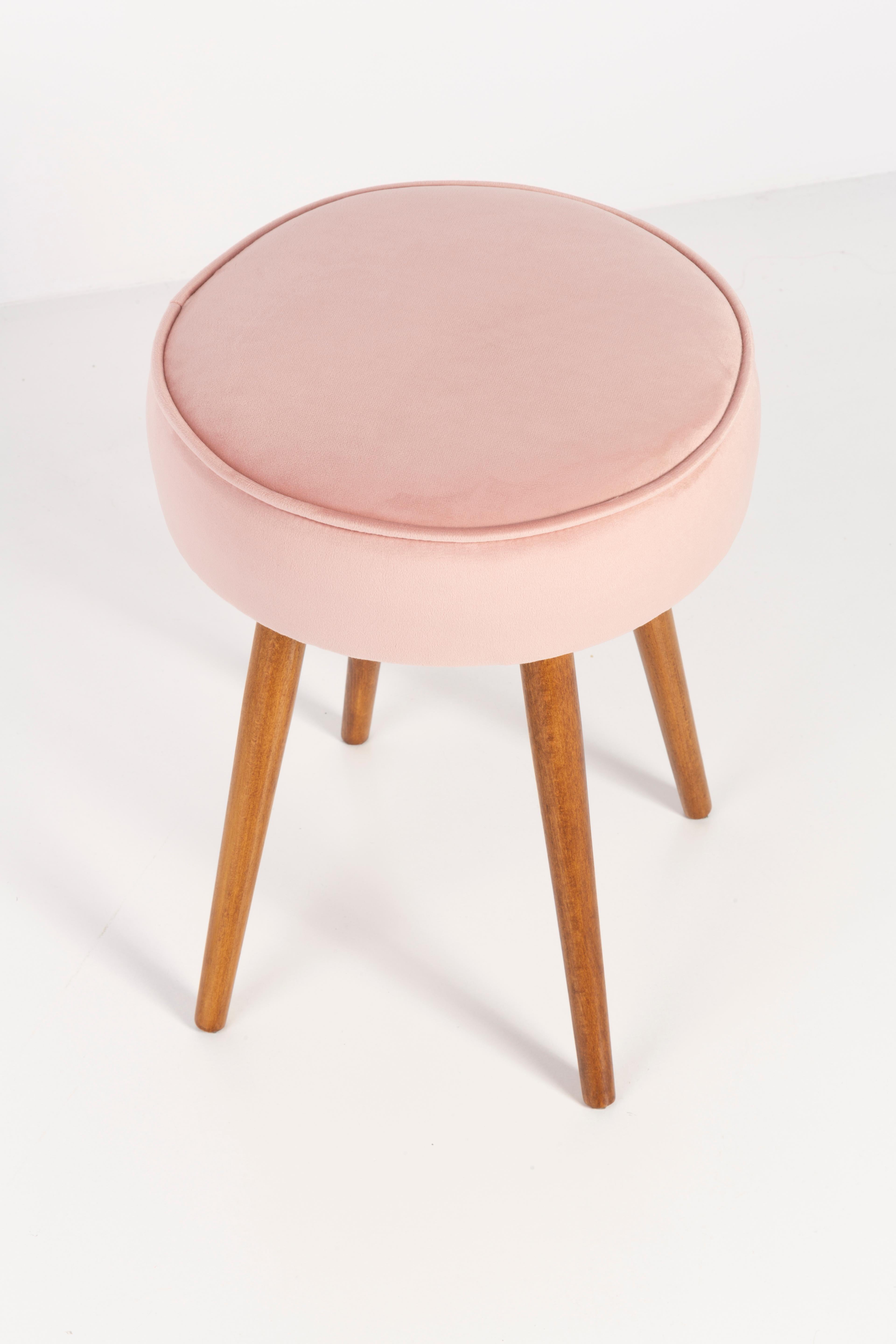 Stool from the turn of the 1960s and 1970s. Beautiful baby pink upholstery. The stool consists of an upholstered part, a seat and wooden legs narrowing downwards, characteristic of the 1960s style. We can prepare this pair also in another color of