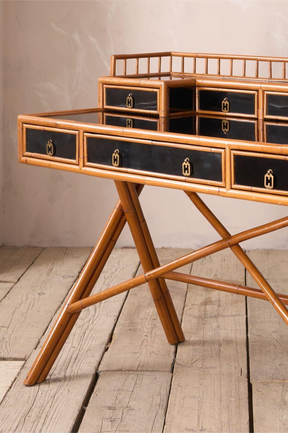 This is a very stylish and extremely well made desk by E Murio. The bamboo gives this a great design that will work well in a huge number of interiors and is accented perfectly with the black lacquer which is in very good condition as well. The