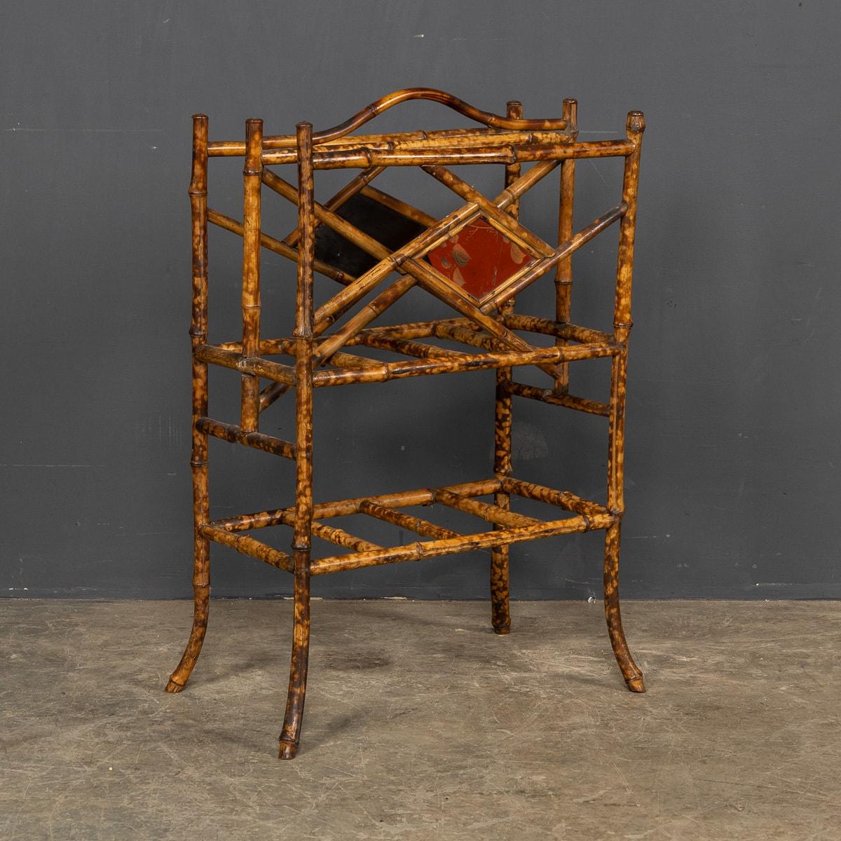 A beautiful early 20th century very stylish bamboo magazine rack with a Japanesque lacquered finish.

CONDITION
In Good Condition. (please refer to photographs)

Size
Height: 70cm
Width: 46cm
Depth: 26cm.