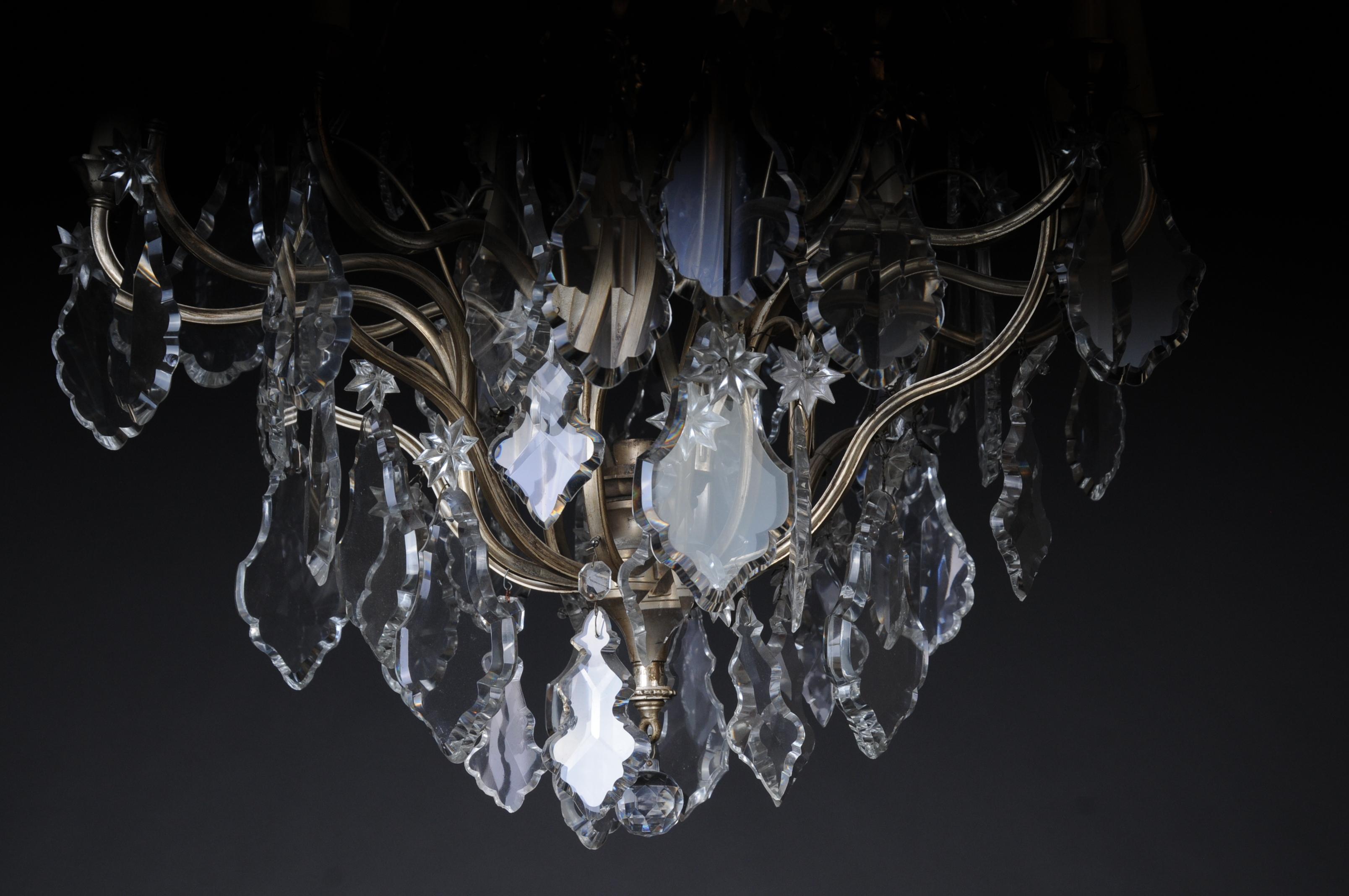 20th century Baroque crystal chandelier, silver, circa 1920
Beautiful Baroque chandelier, silvered brass body. 13-light. Ground crystal prisms. Electrified and tested.
Classic French form. Extremely decorative.

(F-95).