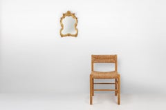 20th Century Baroque gilded shaped oval mirror, France