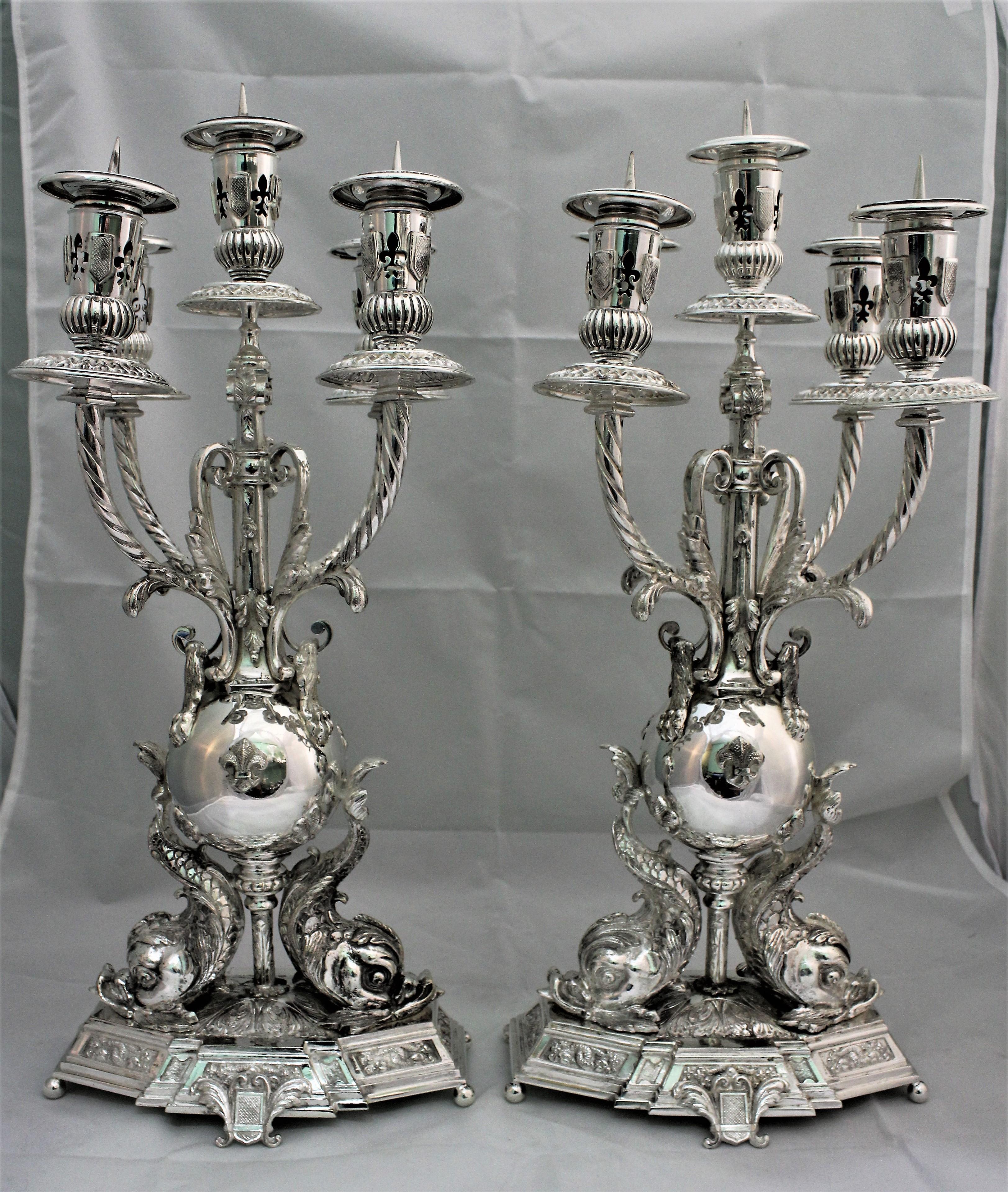 Pair of silver candelabras realized around 1950s in Florence by the famous Florentine silversmith Brandimarte.

Impressive dimension H 52 cm x 22 x 20 cm

Base octagonal upon which there are 2 tritons holding the upper part of the