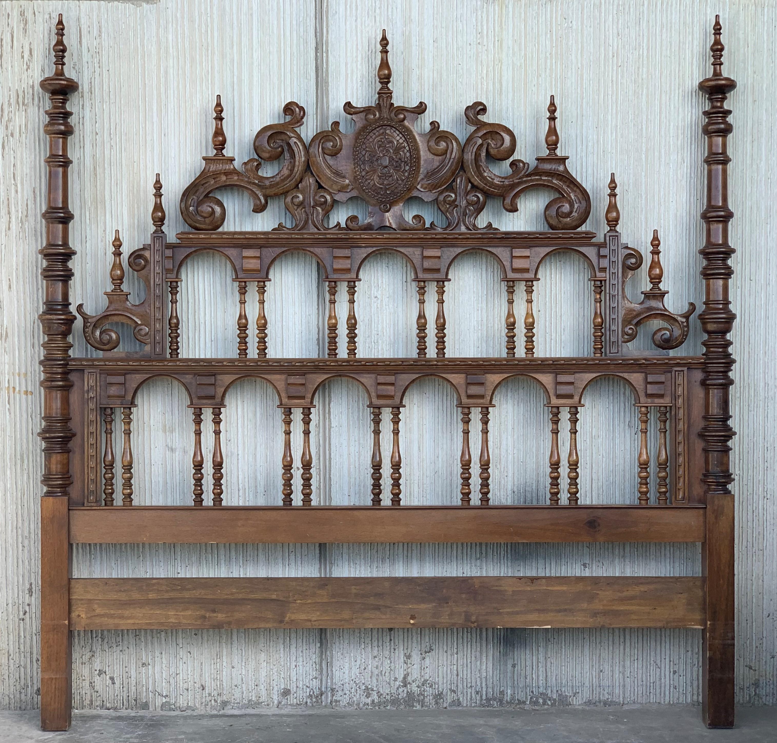 20th century Baroque style king size headboard in carved walnut.
