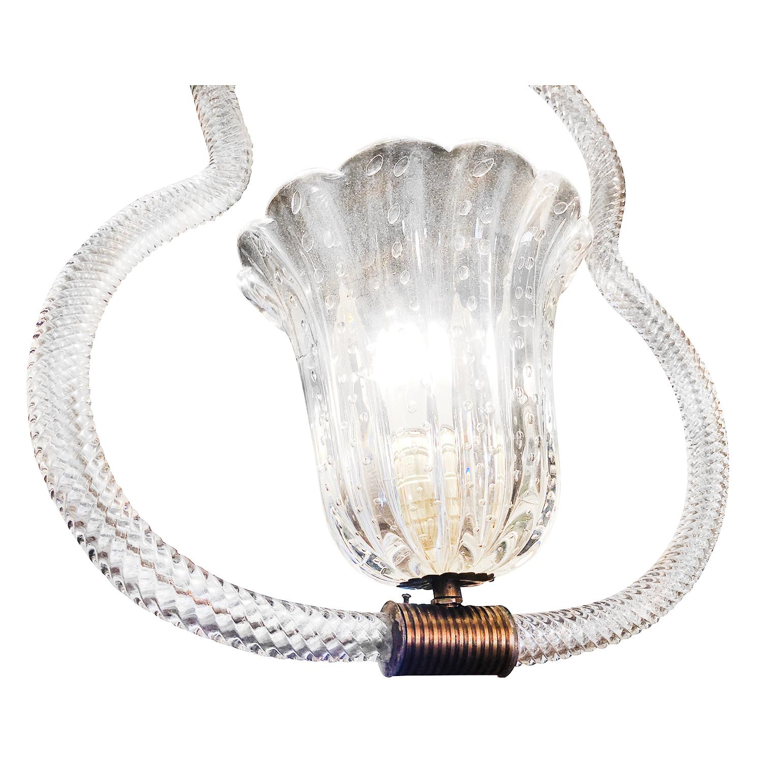 A vintage Mid-Century Modern Italian transparent chandelier made of hand blown Murano glass and brass, imitating a guitar. Featuring a one light socket in good condition. The wires have been renewed. Wear consistent with age and use. Circa 1940 –