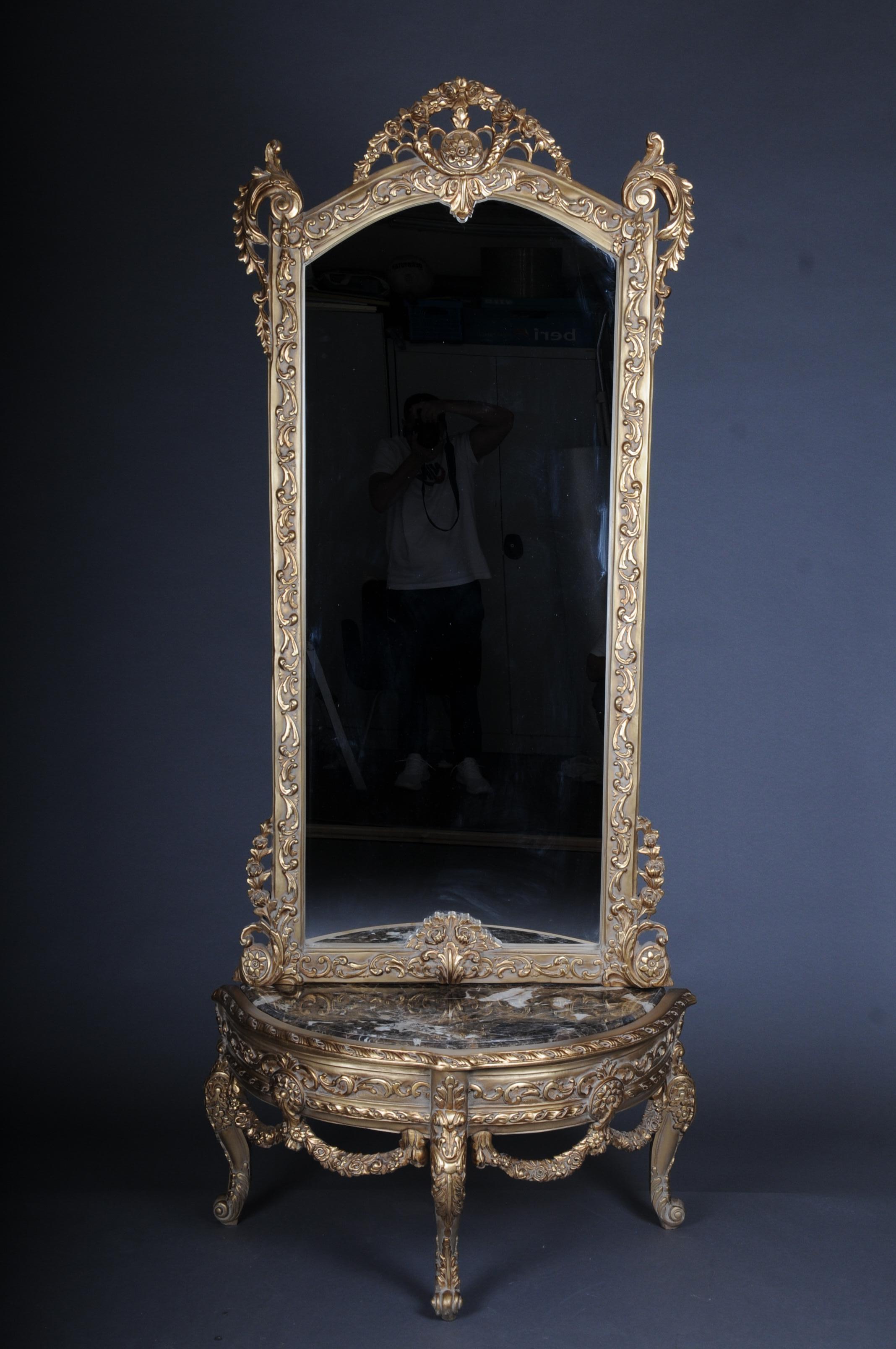 20th Century beautiful console mirror/floor mirror in the Louis XV, gilt

Solid beechwood, carved and painted. Semicircular high-rectangular body on conical, fluted legs. Cambered frame with surrounding carvings, inlaid marble top. High