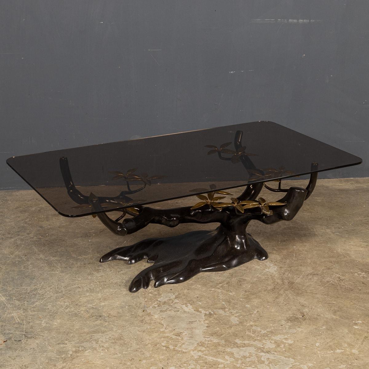 A most unusual mid 20th Century Belgian large smoked glass topped coffee table with a bonsai tree base in black metal with gilt flowers, This iconic coffee table is a real conversation piece. This iconic design is attributed to Willy Daro.