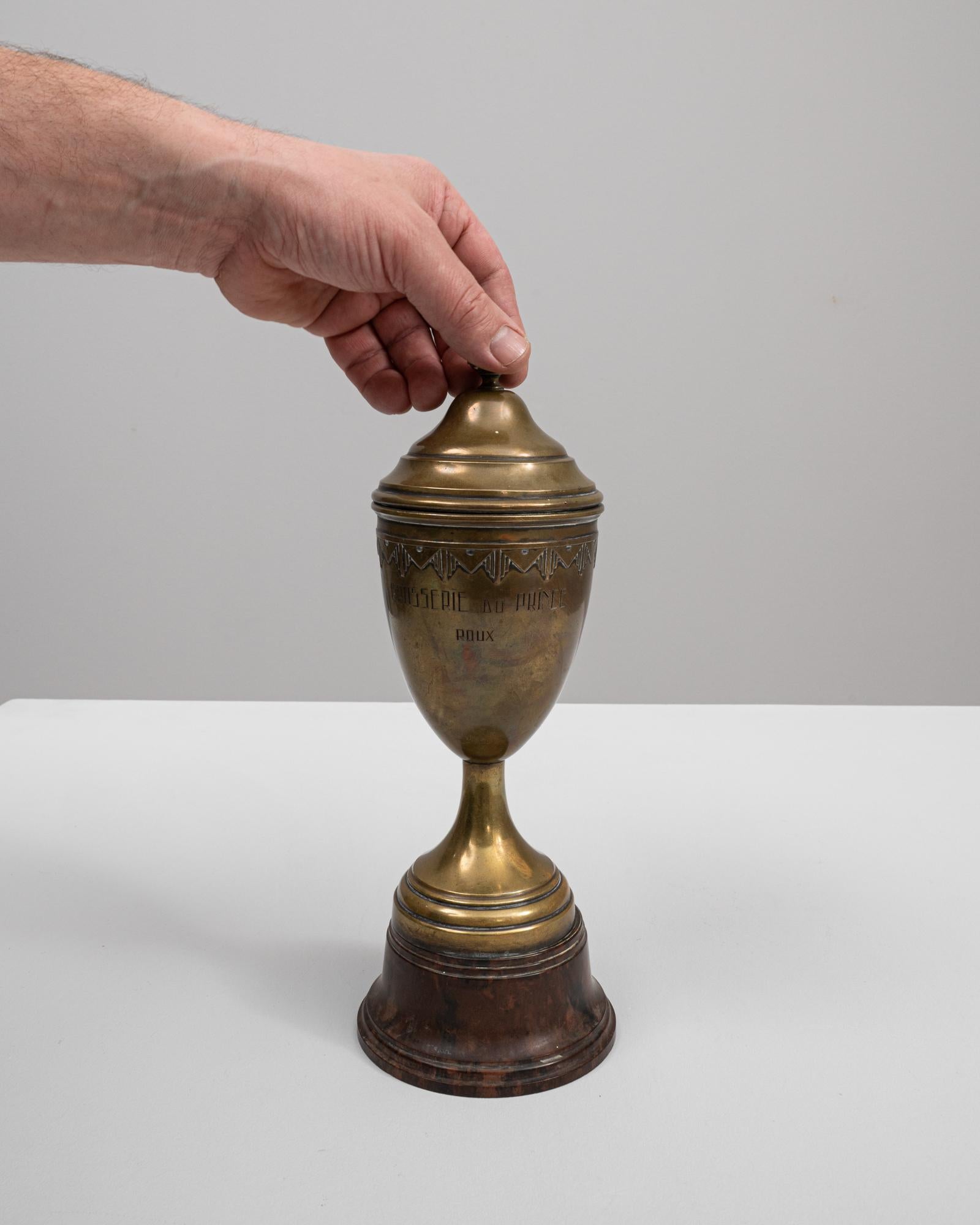 This 20th-century Belgian brass goblet is a piece rich in history and character, hailing from the renowned 