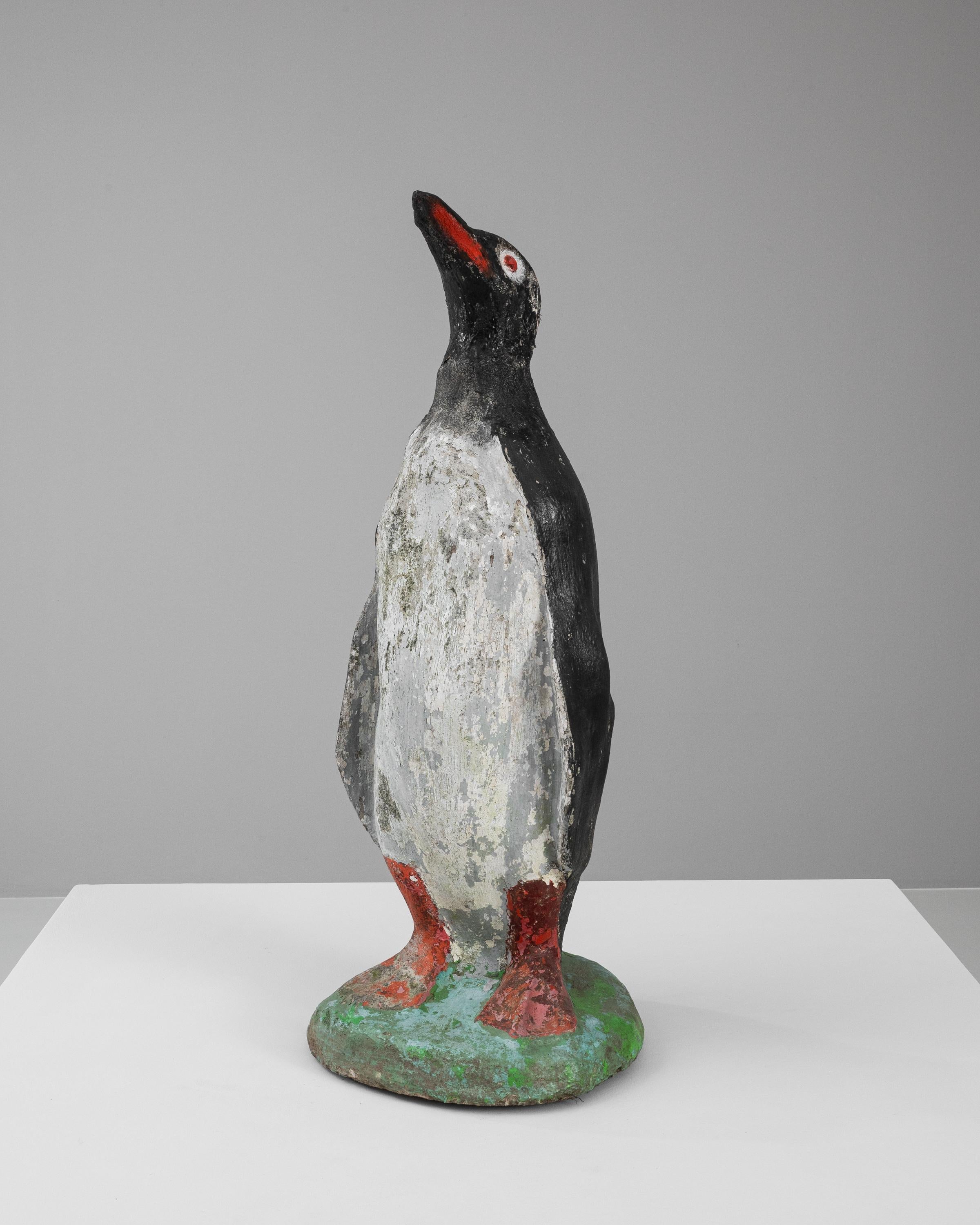Add a touch of whimsical charm to your space with this distinctive 20th-century Belgian concrete sculpture of a penguin. This art piece captures the playful essence of one of nature's most endearing creatures. Handcrafted with attention to detail,