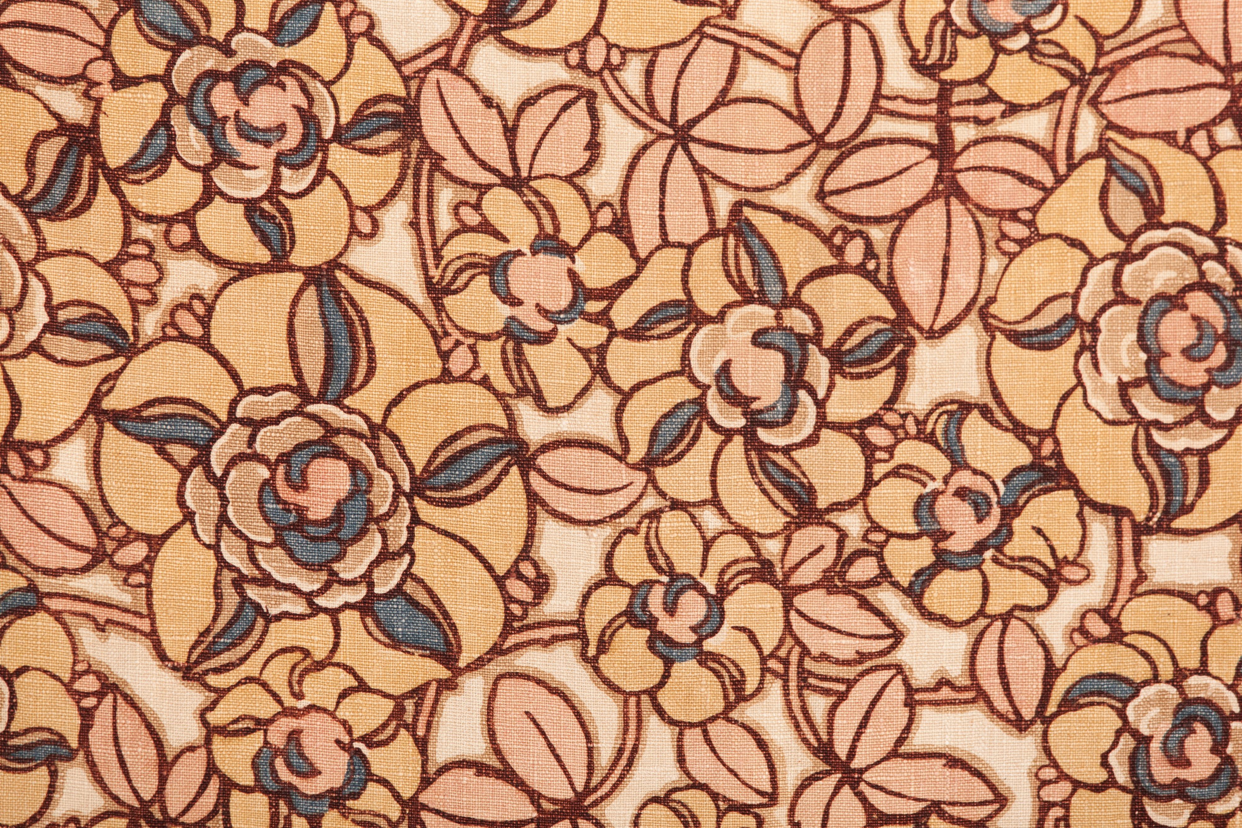Evoking the stylized designs of the Wiener Werkstätte, this stenciled floral textile originated in Belgium. Note the playful arrangement and coloring of the florals and the snappy border.