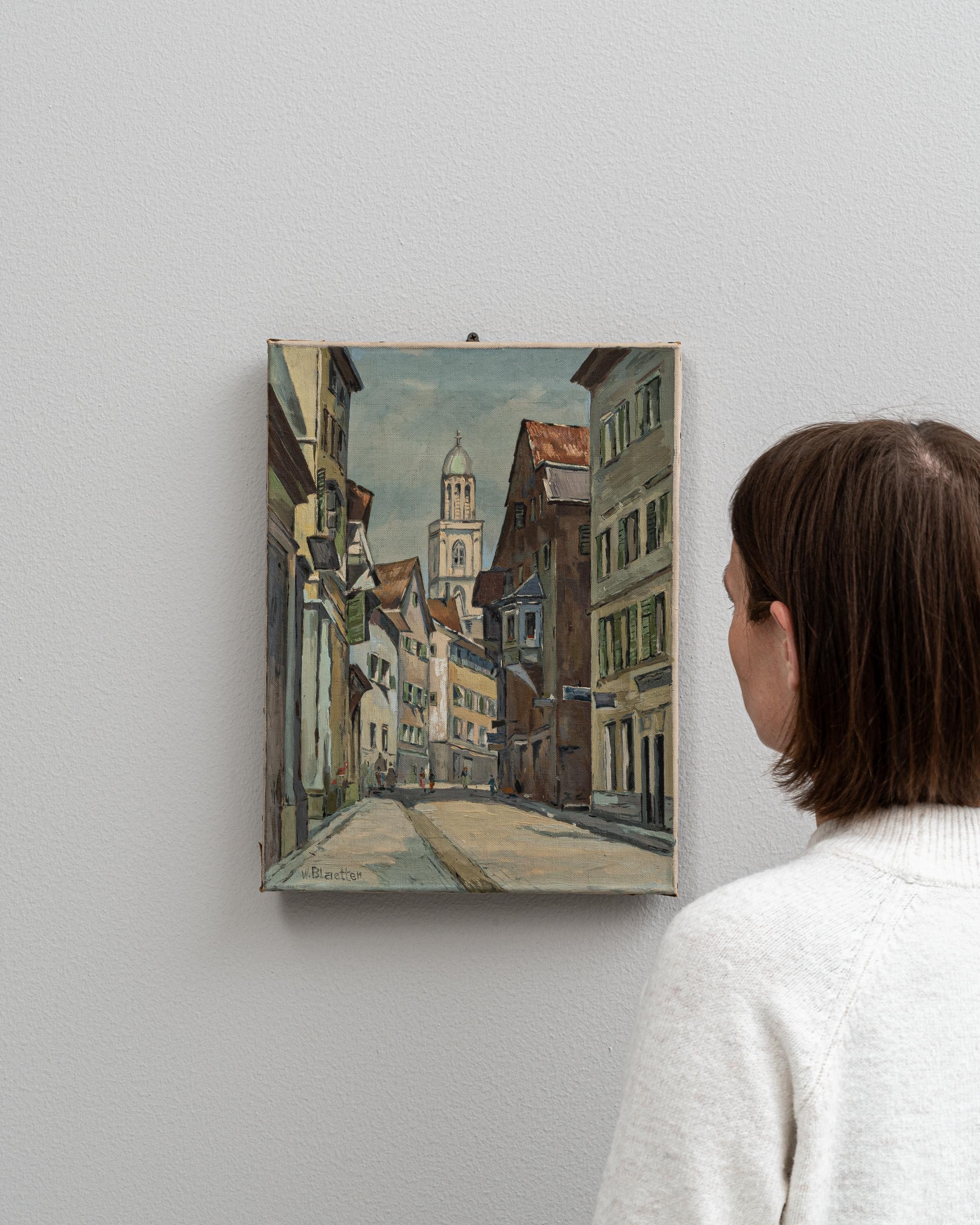 This charming 20th-century Belgian painting offers a vivid portrayal of an old European street, likely nestled in a historic city known for its rich culture and architecture. The artist captures the essence of European street life with sharp,